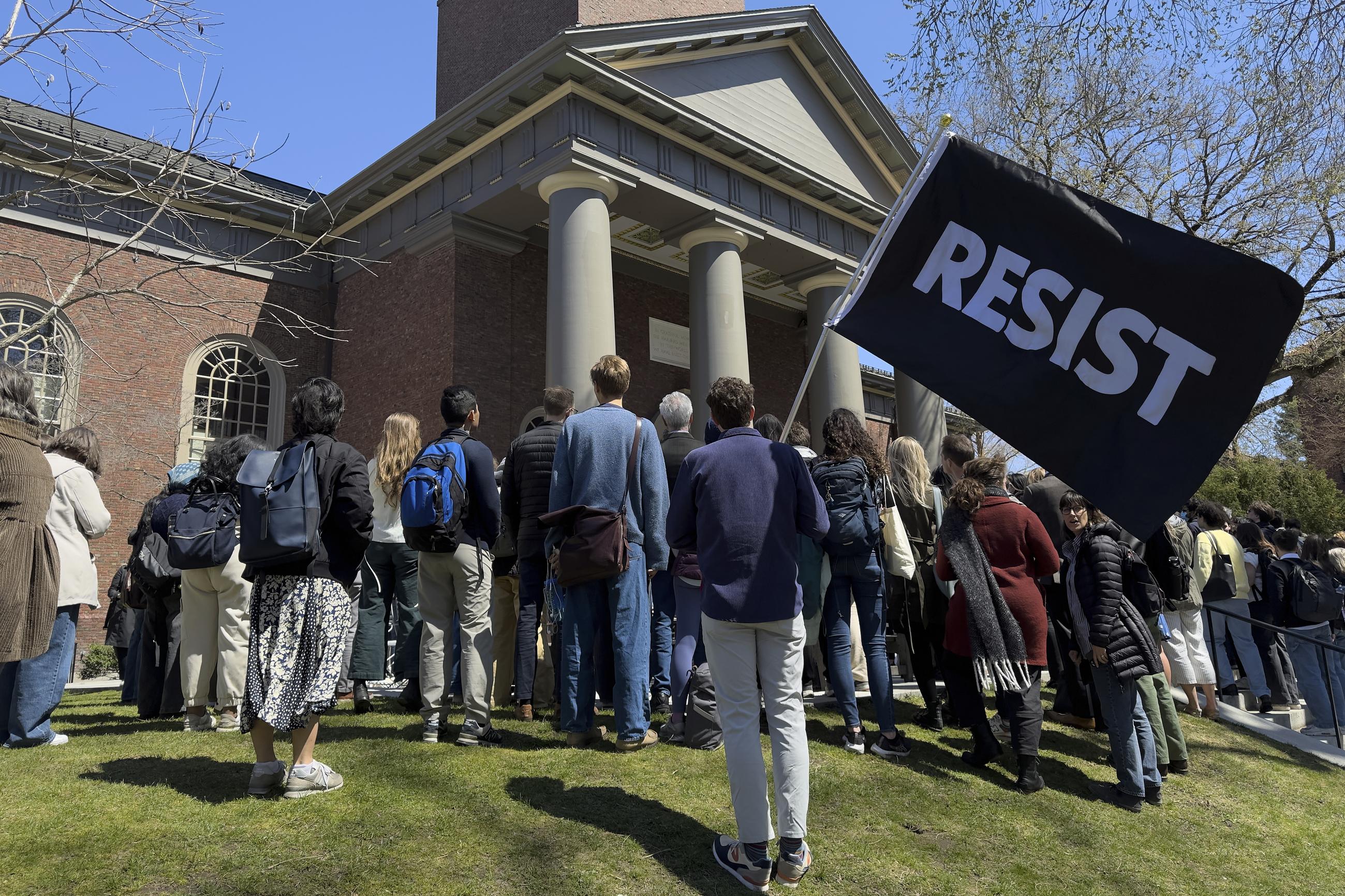 Students, faculty, and members of the Harvard University community rally in Cambridge, Mass., on April 17. (AP Photo)