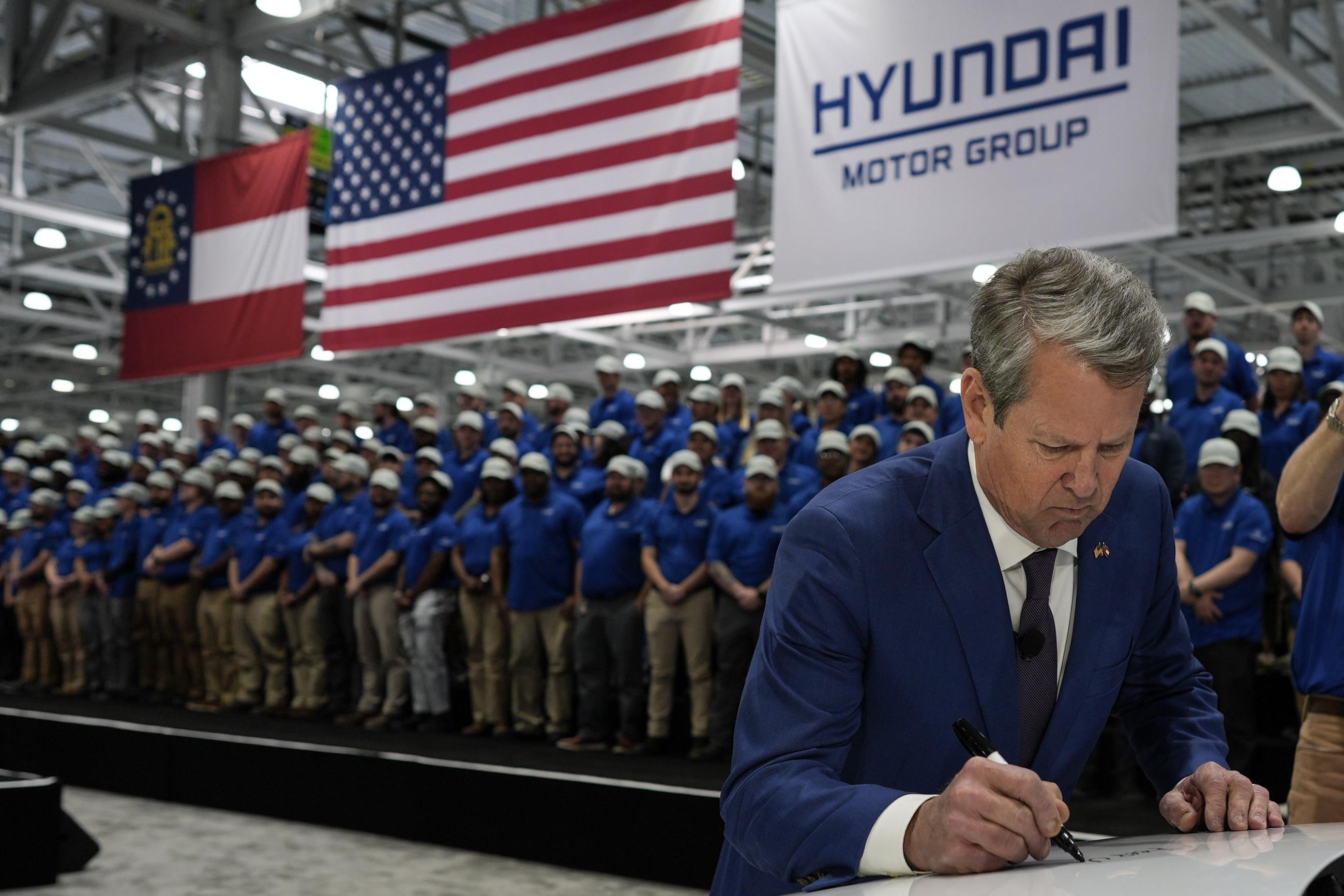 Georgia Gov. Brian Kemp signs a IONIQ 9 EV vehicle during a media tour and grand opening at the Hyundai Motor Group Metaplant America in March. (AP Photo/Mike Stewart)