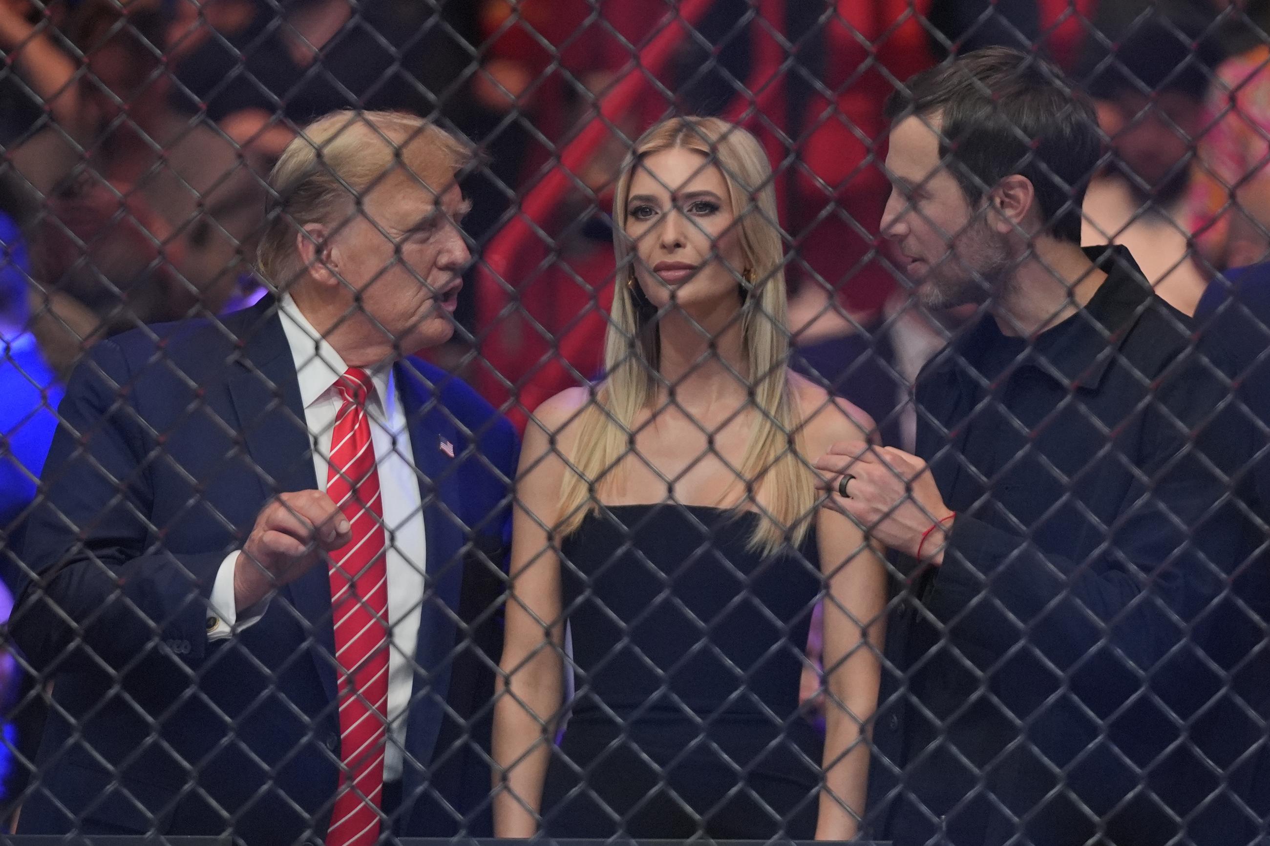 Donald Trump talks to his daughter Ivanka Trump and son-in-law Jared Kushner as they wait for the start of a UFC 299 mixed-martial arts bout in March 2024 in Miami. (AP Photo/Wilfredo Lee)