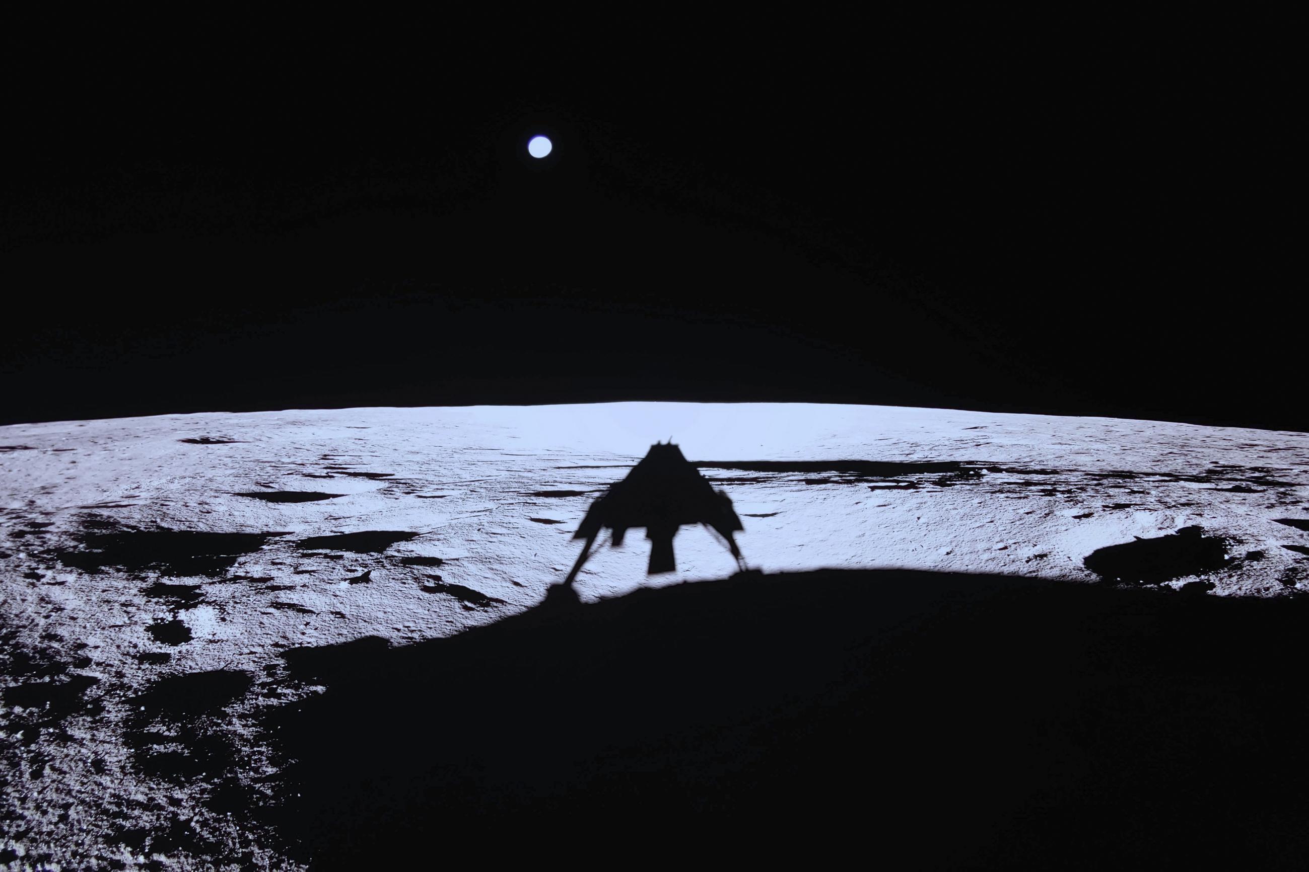 Private lunar lander Blue Ghost's shadow is seen on the moon's surface after touching down on March 2. (NASA/Firefly Aerospace via AP)