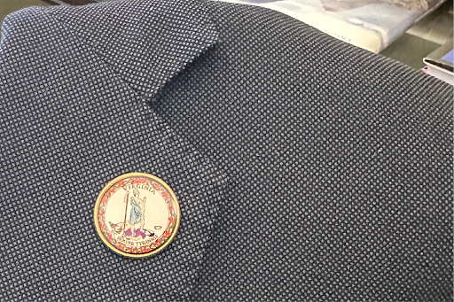 A lapel pin with Virginia's state seal, which Sen. Tim Kaine now wears instead of his usual Senate pin (Photo by Savannah Behrmann)