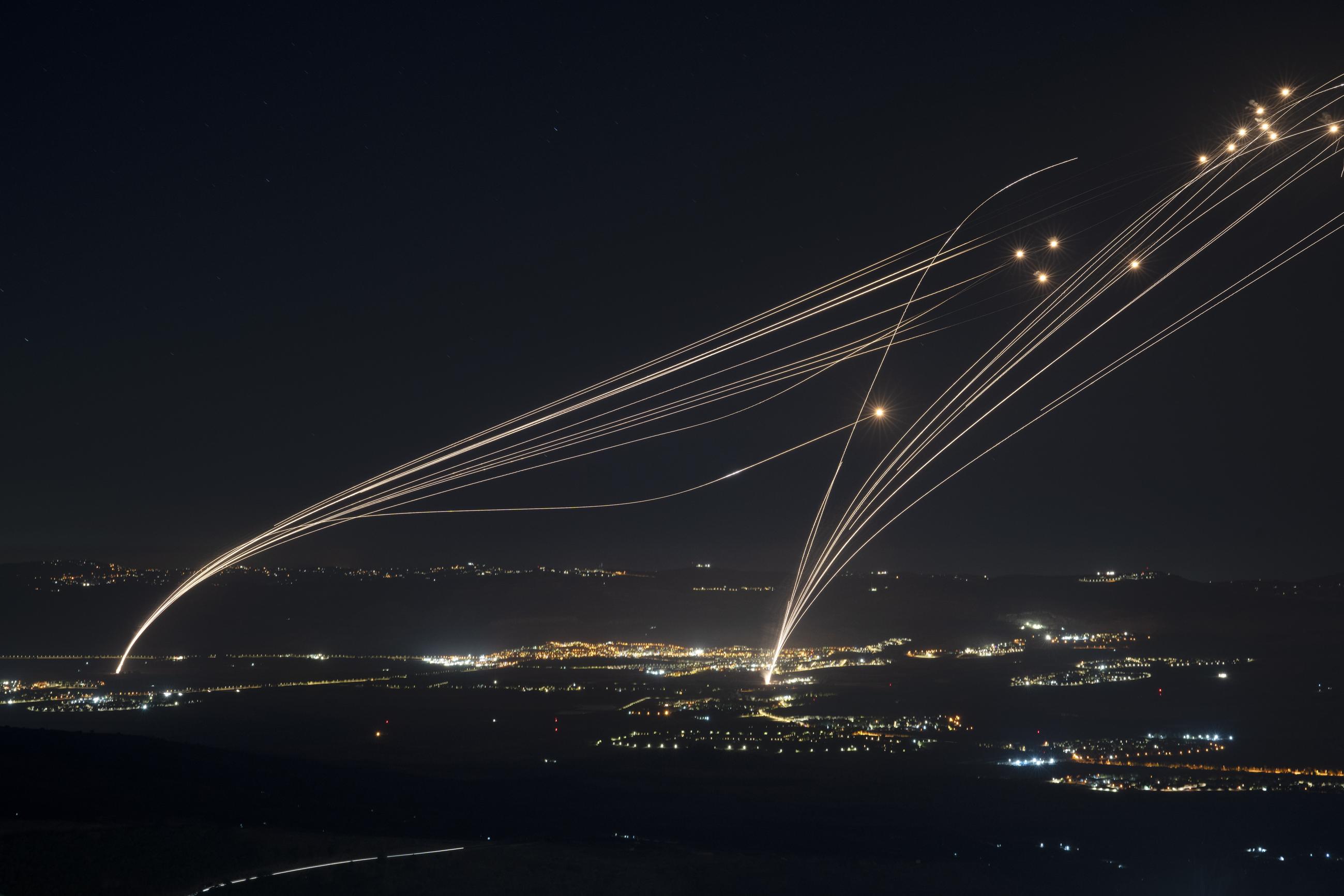 The Israeli Iron Dome air defense system fires to intercept an attack from Lebanon over the Galilee region as seen from the Israeli-annexed Golan Heights. (AP Photo/Leo Correa)