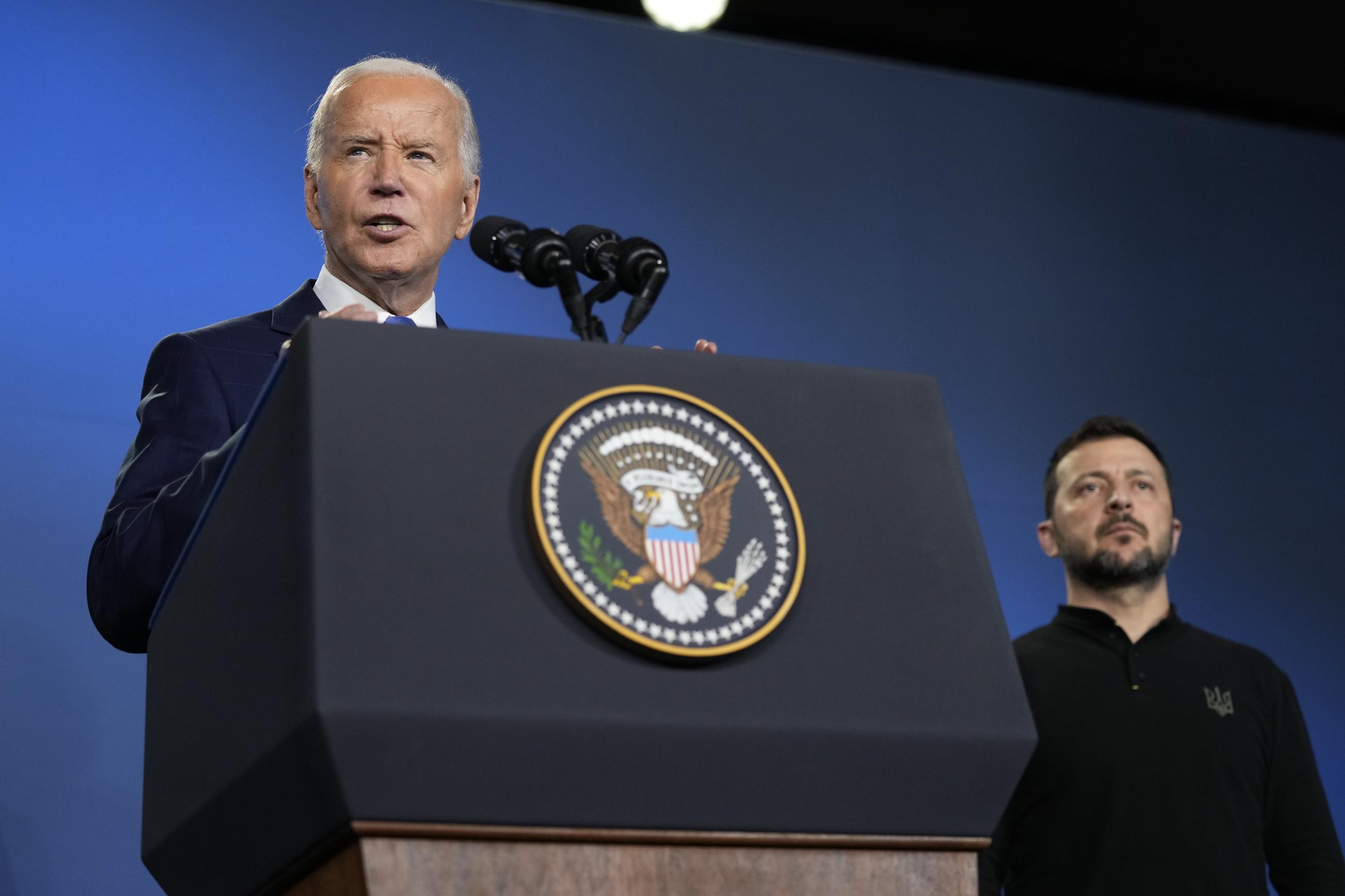 FILE - President Joe Biden, left, joined by President of Ukraine Volodymyr Zelenskyy, speaks during an event on the Ukraine Compact on the sidelines of the NATO Summit in Washington, Thursday, July 11, 2024. (AP Photo/Susan Walsh, File)