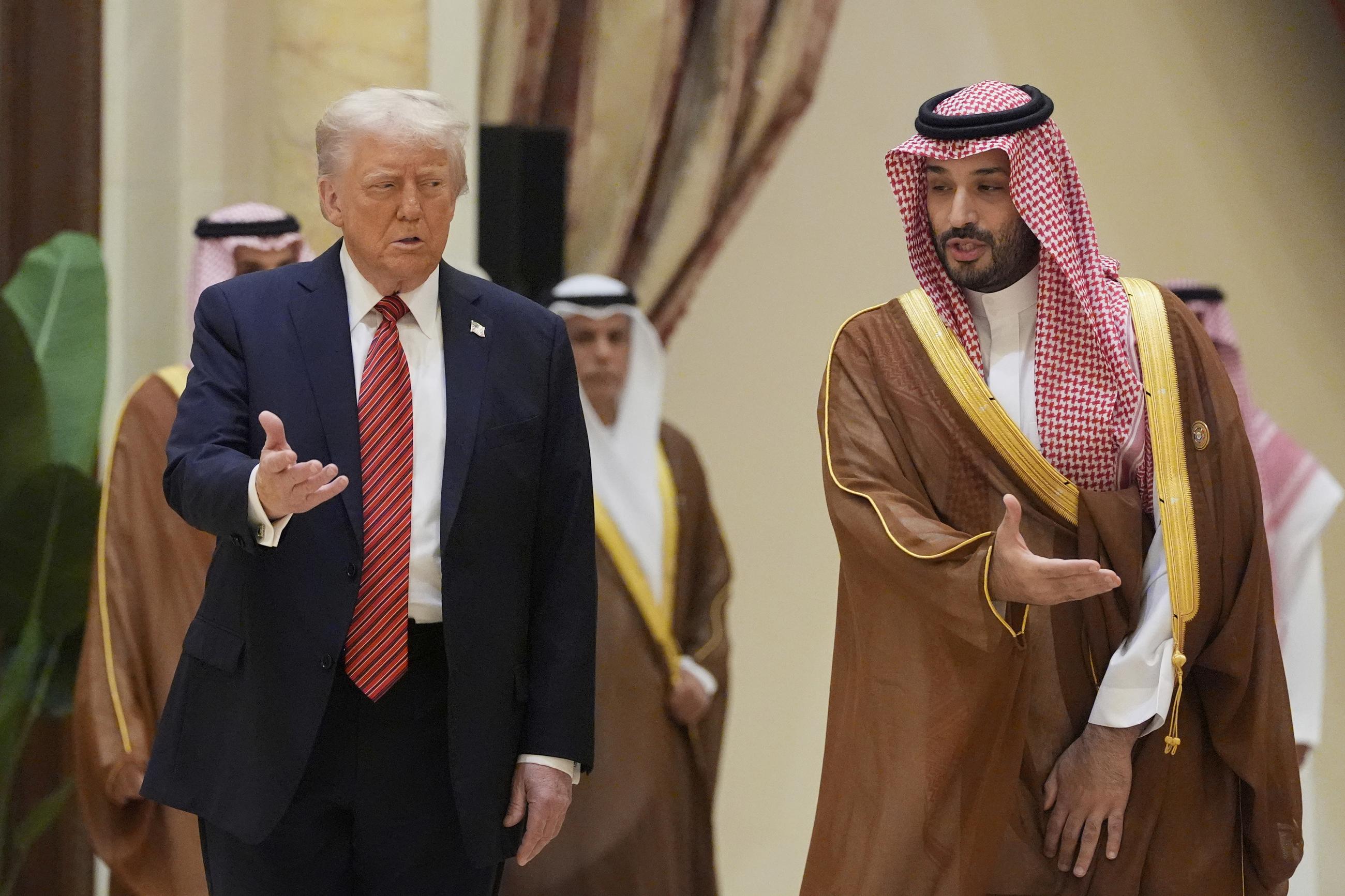 President Trump arrives with Saudi Crown Prince Mohammed bin Salman for the group photo with Gulf Cooperation Council leaders during the GCC Summit in Riyadh, Saudi Arabia, Wednesday. (AP Photo/Alex Brandon)