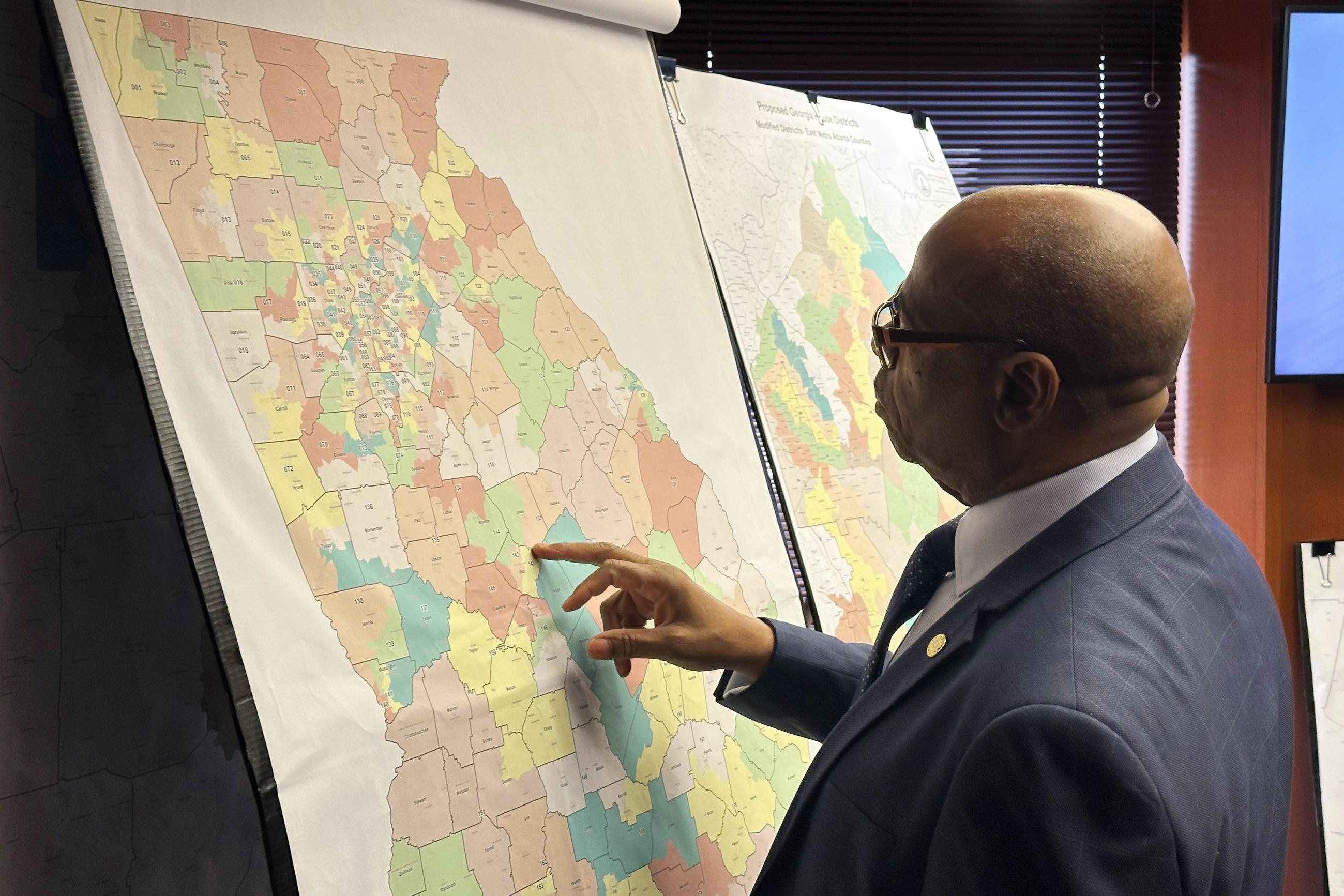 FILE - Georgia state Rep. Mack Jackson, D-Sandersville, looks at a map of proposed state House districts before a House hearing, Wednesday, Nov. 29, 2023, at the Georgia Capitol in Atlanta. (AP Photo/Jeff Amy, file)