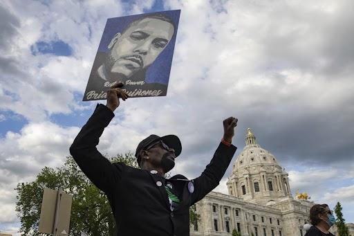 A demonstrator at a 2021 rally in St. Paul, Minn., on the one-year anniversary of George Floyd's death (AP Photo/Christian Monterrosa)