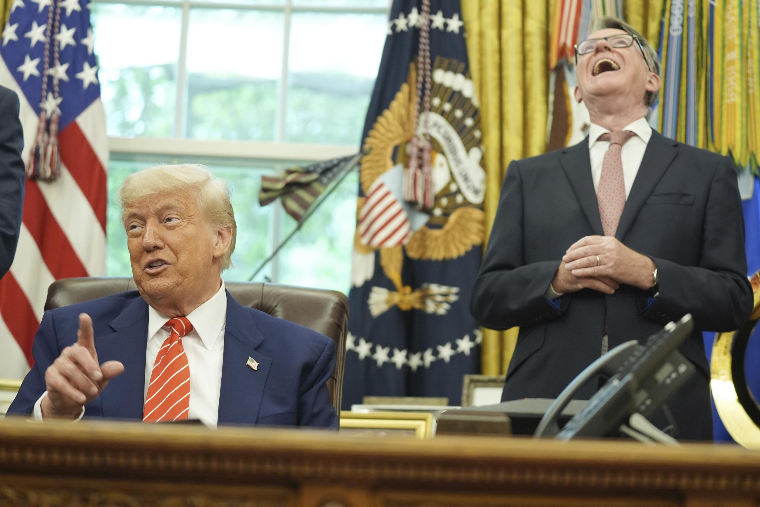 President Trump, with British ambassador Peter Mandelson, taking questions from members of the media after announcing a trade deal between U.S. and U.K. in the Oval Office on May 8 (AP Photo/Evan Vucci)