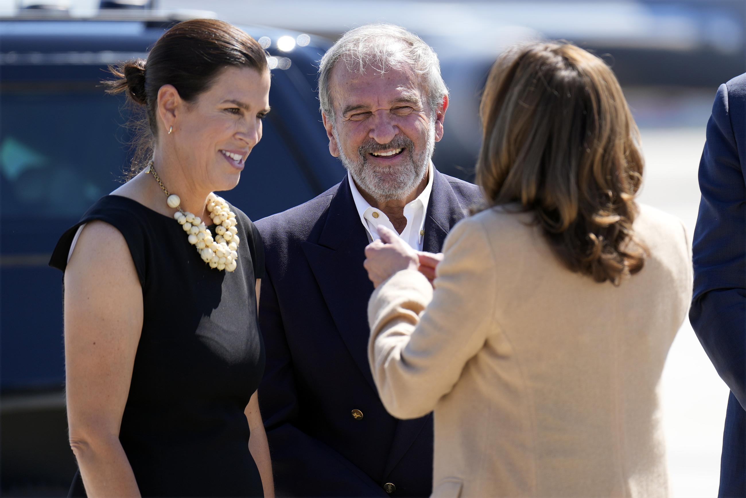 Democratic presidential nominee Vice President Kamala Harris greets Stefany Shaheen and Billy Shaheen, daughter and husband of Sen. Jeanne Shaheen, D-N.H., as she arrives at Portsmouth International Airport in Portsmouth, N.H., for campaign events, Wednesday, Sept. 4, 2024. (AP Photo/Jacquelyn Martin)