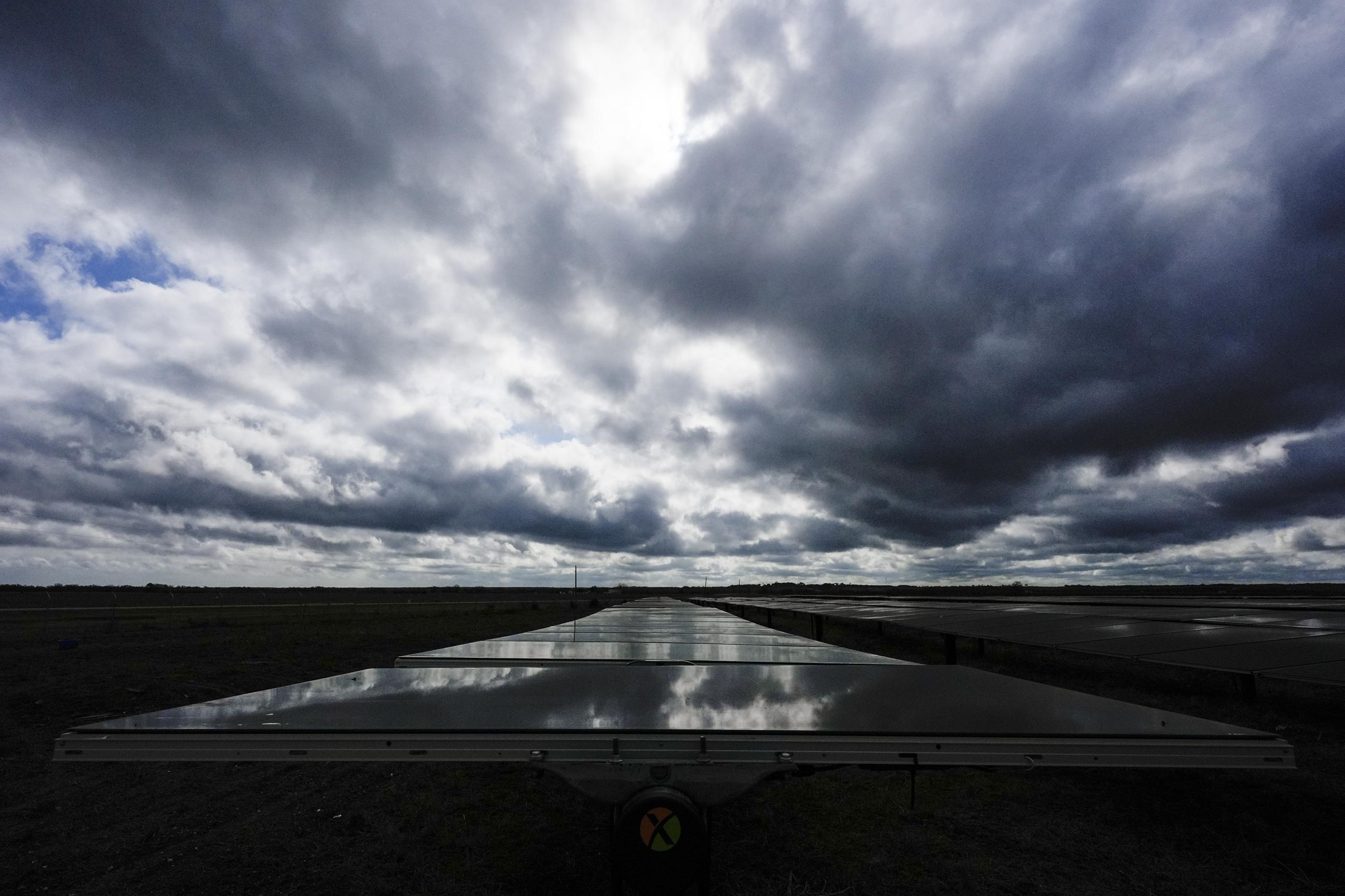 The sun reflects off of a solar panel in Texas. (AP Photo/Ashley Landis)