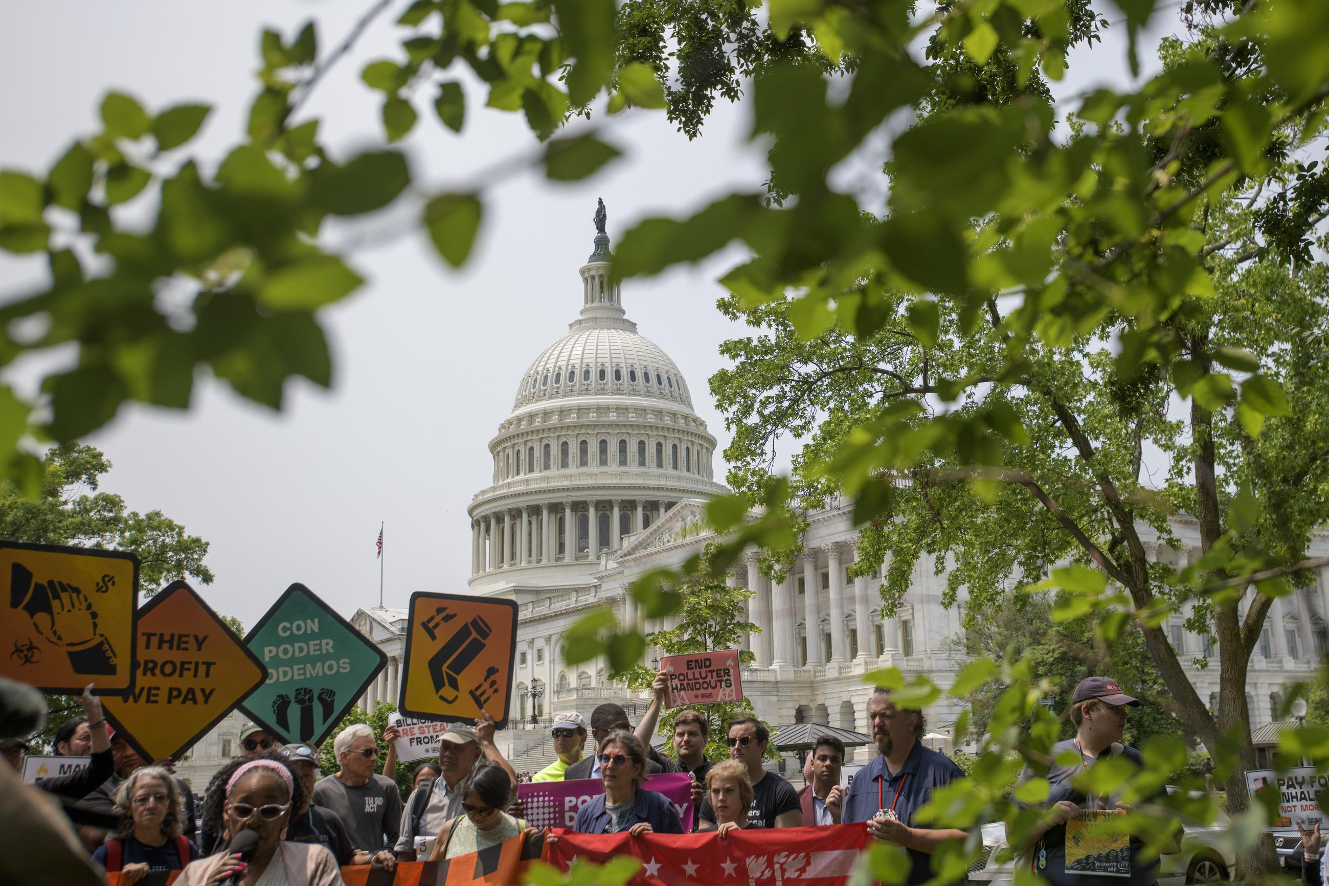 Demonstrators protest prior to a news conference regarding the pending passage of the One Big Beautiful Bill Act at the Capitol, Tuesday, June 3, 2025, in Washington. (AP Photo/Rod Lamkey, Jr.)