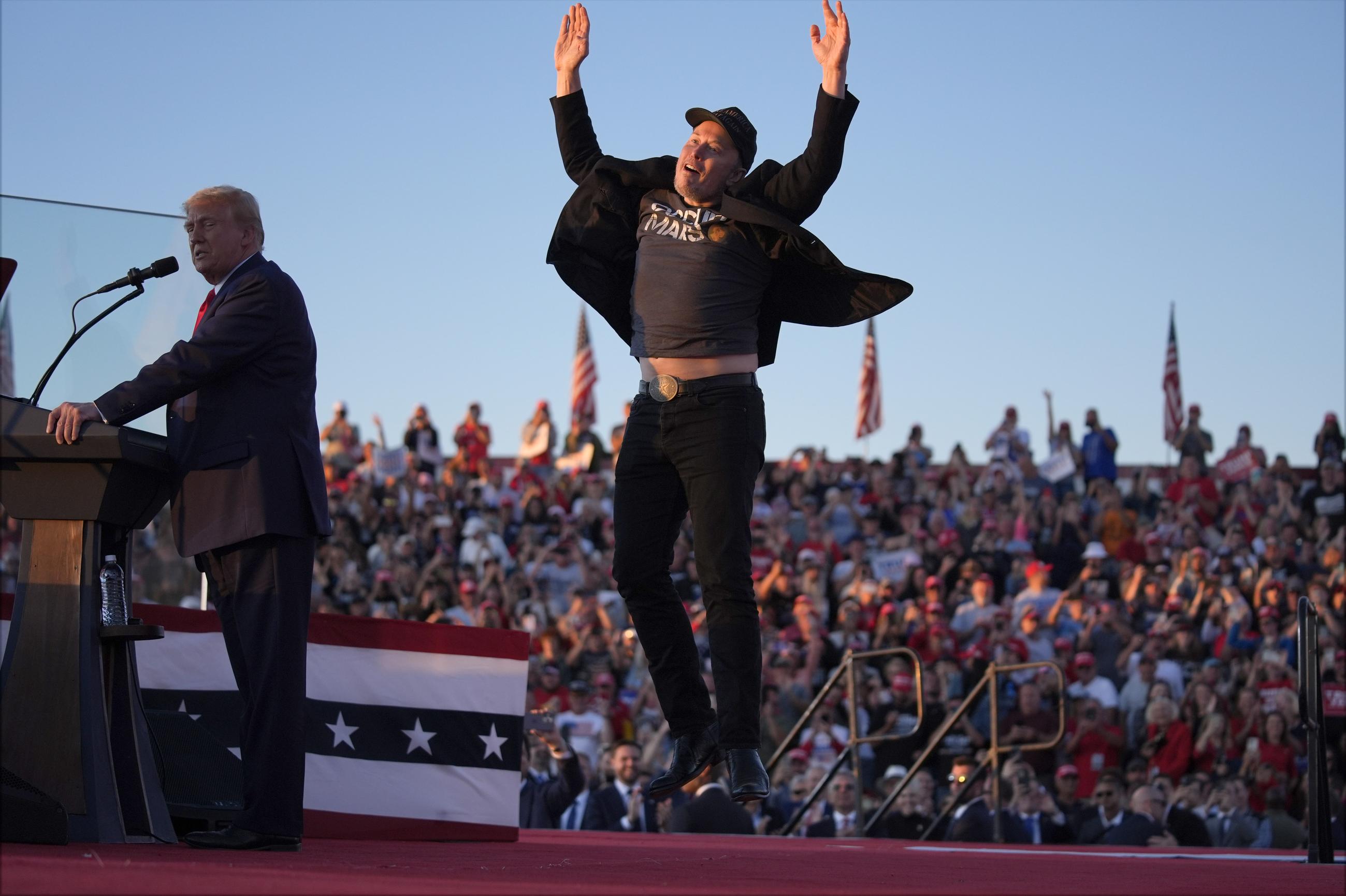 Elon Musk campaigning with Donald Trump in Butler, Pa., in October 2024 (AP Photo/Evan Vucci, File