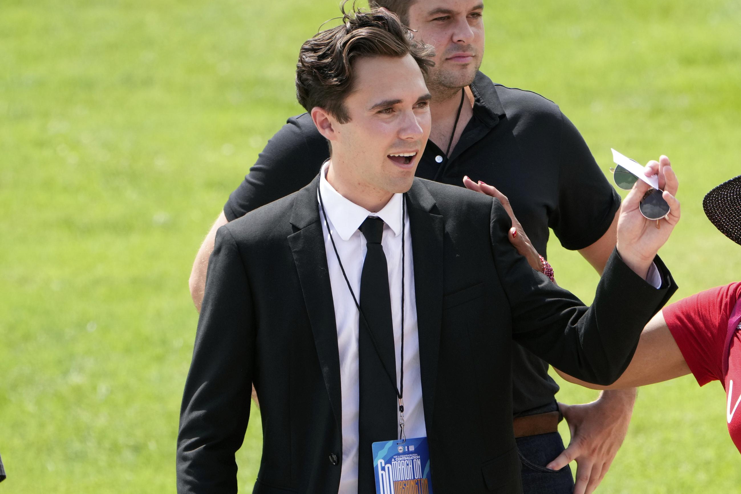 FILE - David Hogg talks to people after speaking at the 60th Anniversary of the March on Washington at the Lincoln Memorial in Washington, Aug. 26, 2023. (AP Photo/Andrew Harnik, File)