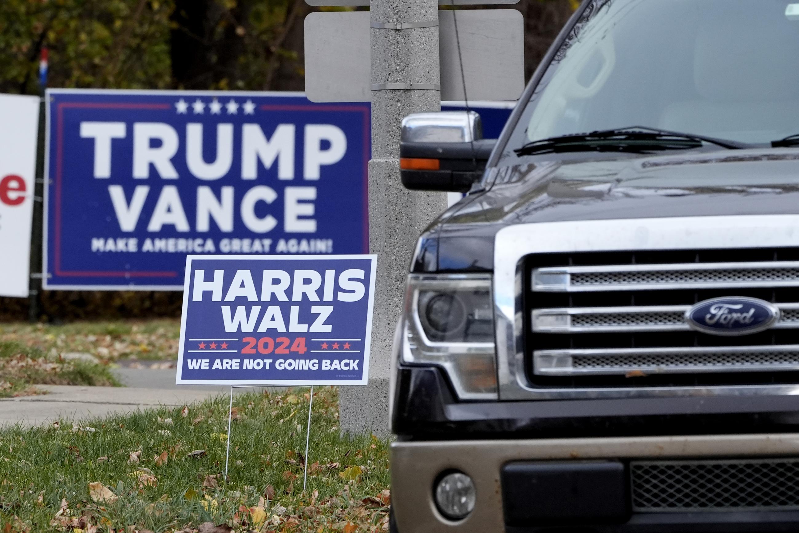 Campaign signs in Janesville, Wis., in 2024 (AP Photo/Charles Rex Arbogast)