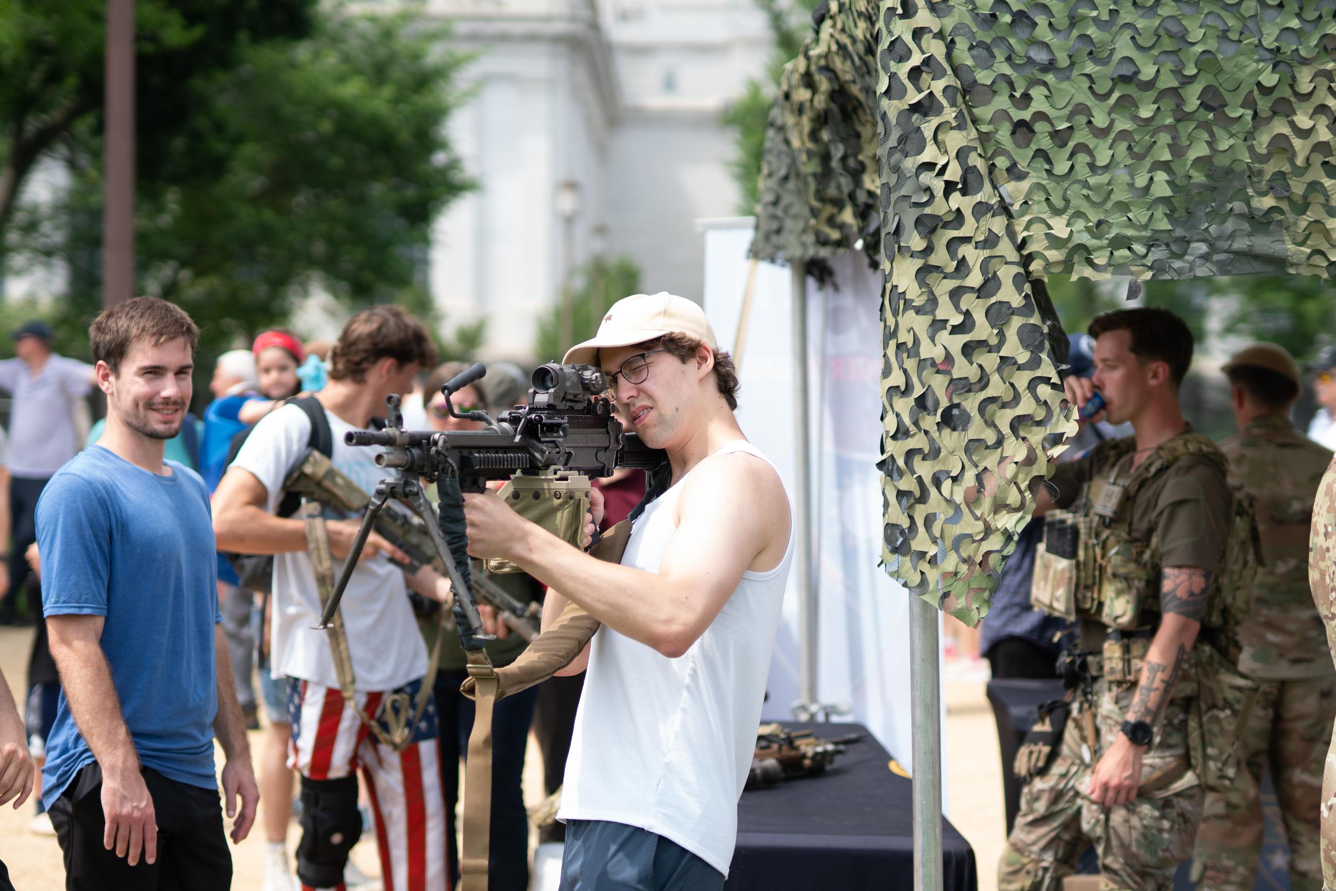 Matuiy Korsunskiy takes aim with a M249 SAW during an event marking the 250th Army Anniversary. June 15, 2025.