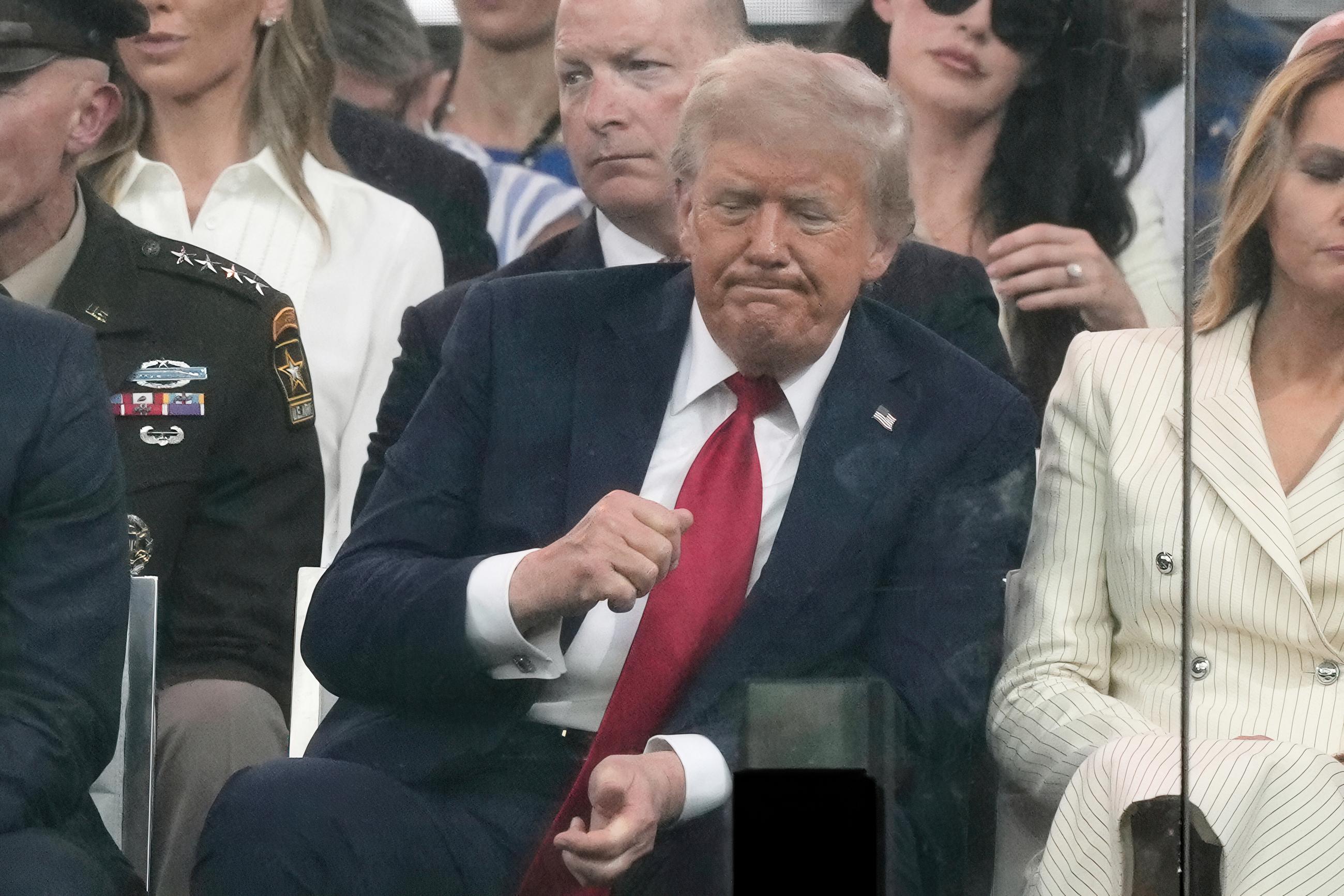 President Donald Trump attends a military parade commemorating the Army's 250th anniversary, coinciding with his 79th birthday, Saturday, June 14, 2025, in Washington. (AP Photo/Julia Demaree Nikhinson)