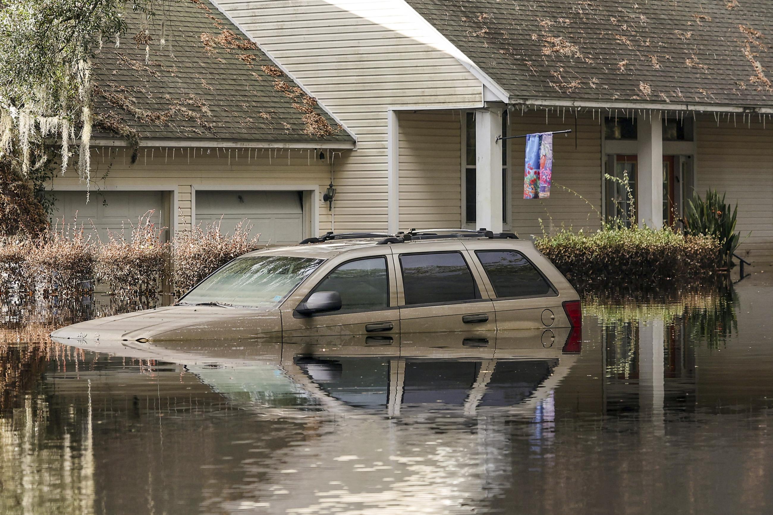 FILE - A neighborhood still flooded from Hurricane Milton prepares to have the FEMA Disaster Recover Center covert to a polling location for the general election on Monday, Nov. 4, 2024, in Ridge Manor, Fla. (AP Photo/Mike Carlson, File)