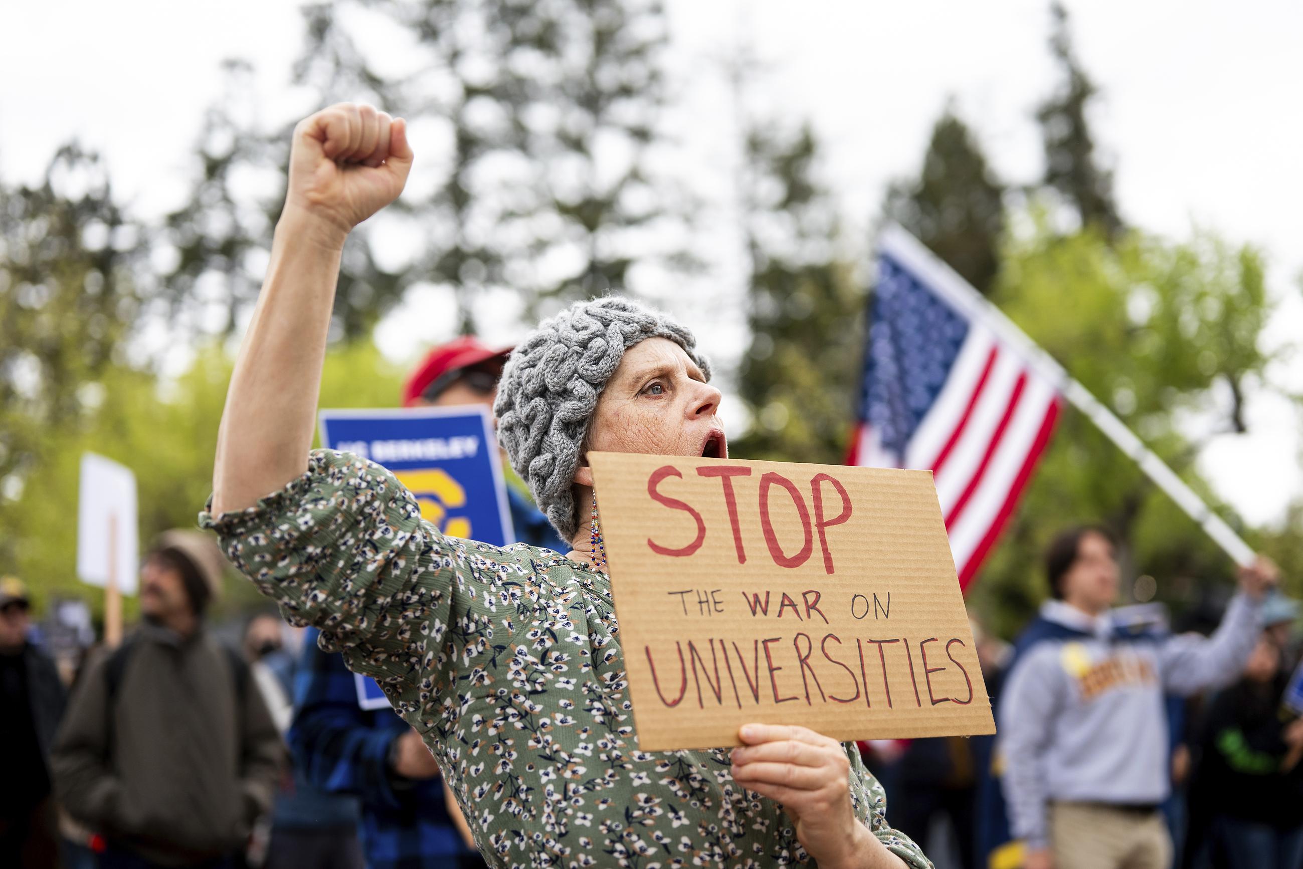 University of California (Berkeley) alumna Bethany Schoenfeld demonstrates against the Trump administration at her alma mater as part of a Day of Action for Higher Education on April 17. (AP Photo/Noah Berger)