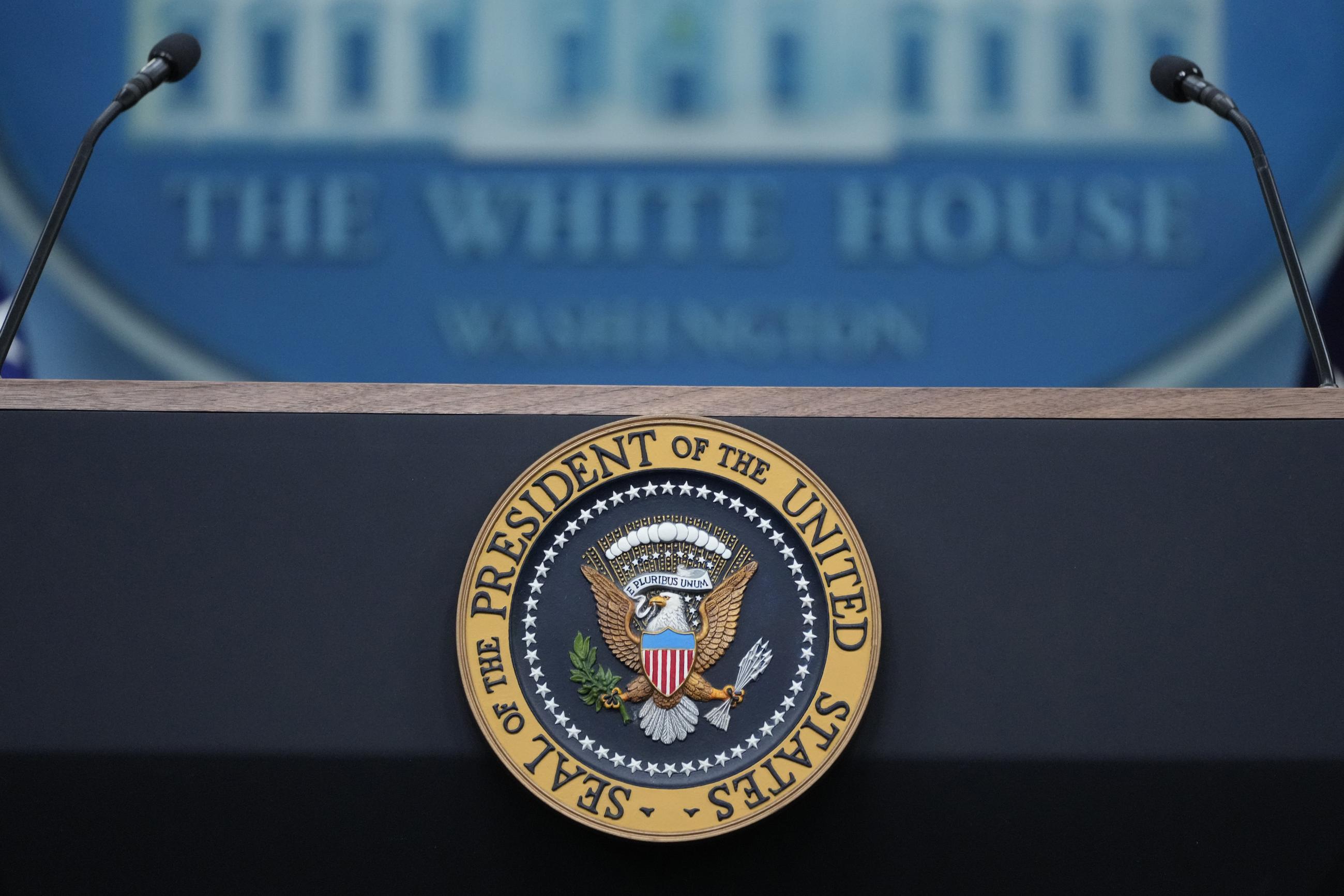 The presidential seal on the podium in the White House briefing room (AP PHOTO/ALEX BRANDON)