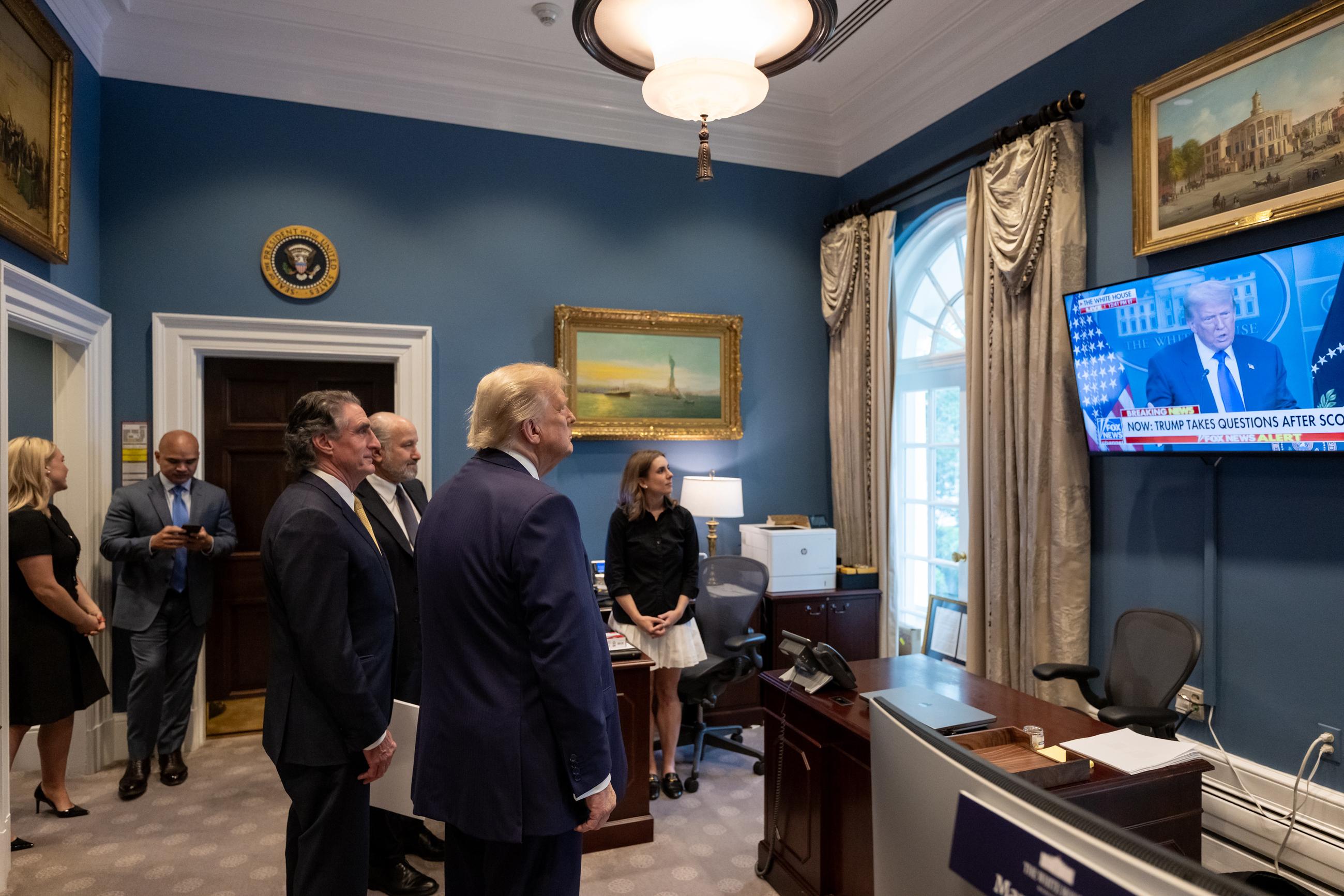 President Trump watches a recap of his press conference in the Outer Oval on June 27. (Official White House Photo by Molly Riley)