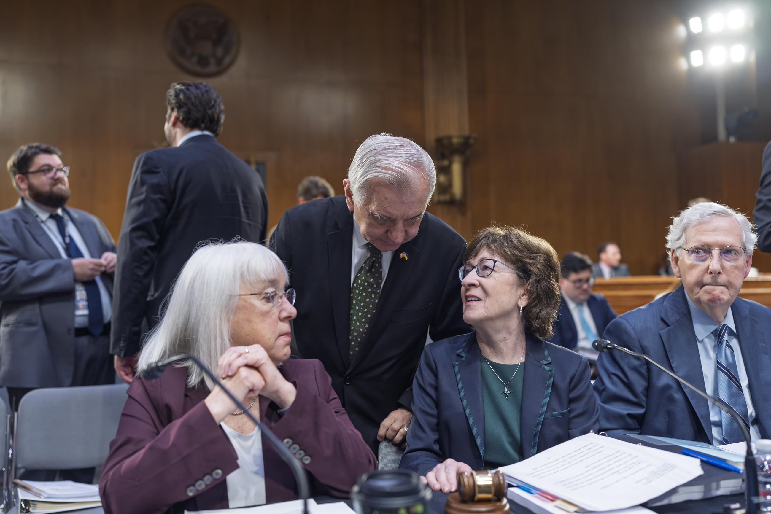 (From left) Sens. Patty Murray, Jack Reed, Susan Collins, and Mitch McConnell confer as the Senate Appropriations Committee marks up a fiscal 2026 spending bill on Thursday. (AP Photo/J. Scott Applewhite)