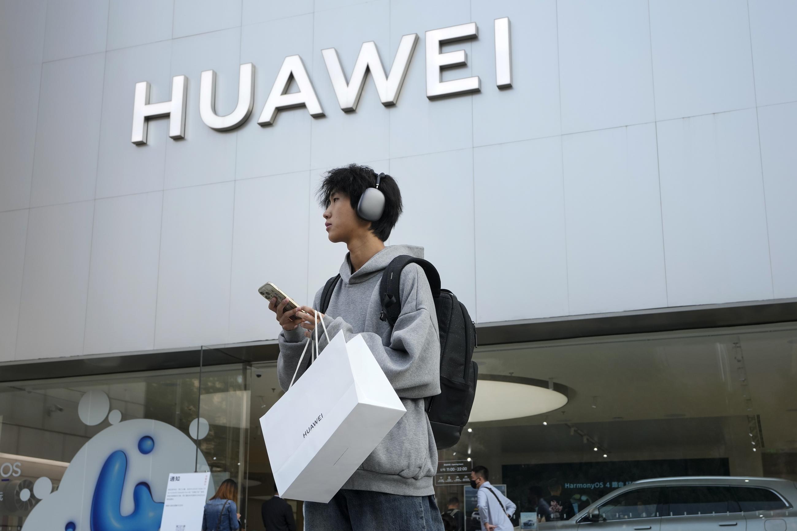 A customer outside a Huawei store. (AP Photo/Andy Wong)