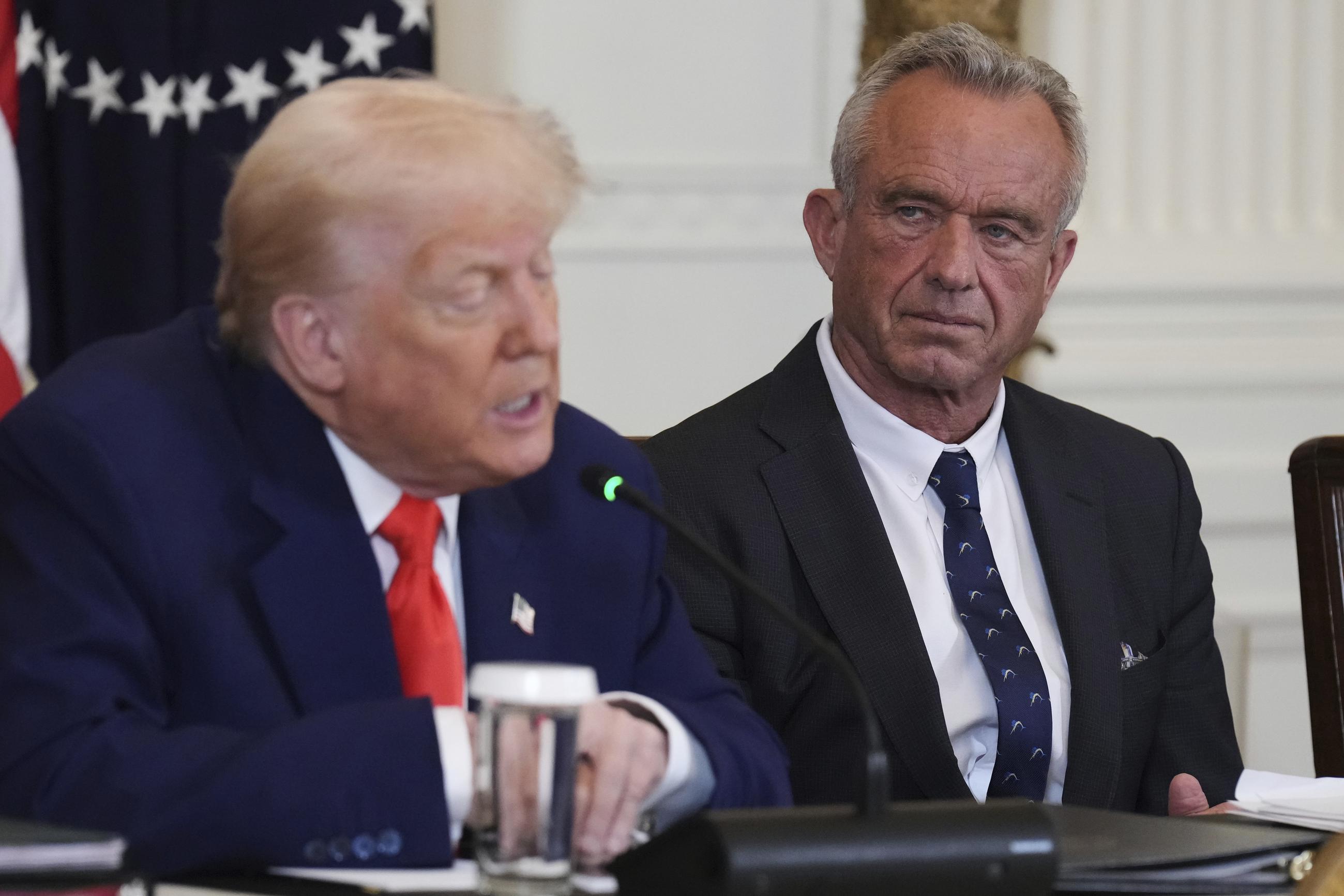 President Trump speaks as Health and Human Services Secretary Robert F. Kennedy Jr. listens during a Make America Healthy Again Commission Event at the White House on May 22. (AP Photo/Jacquelyn Martin)