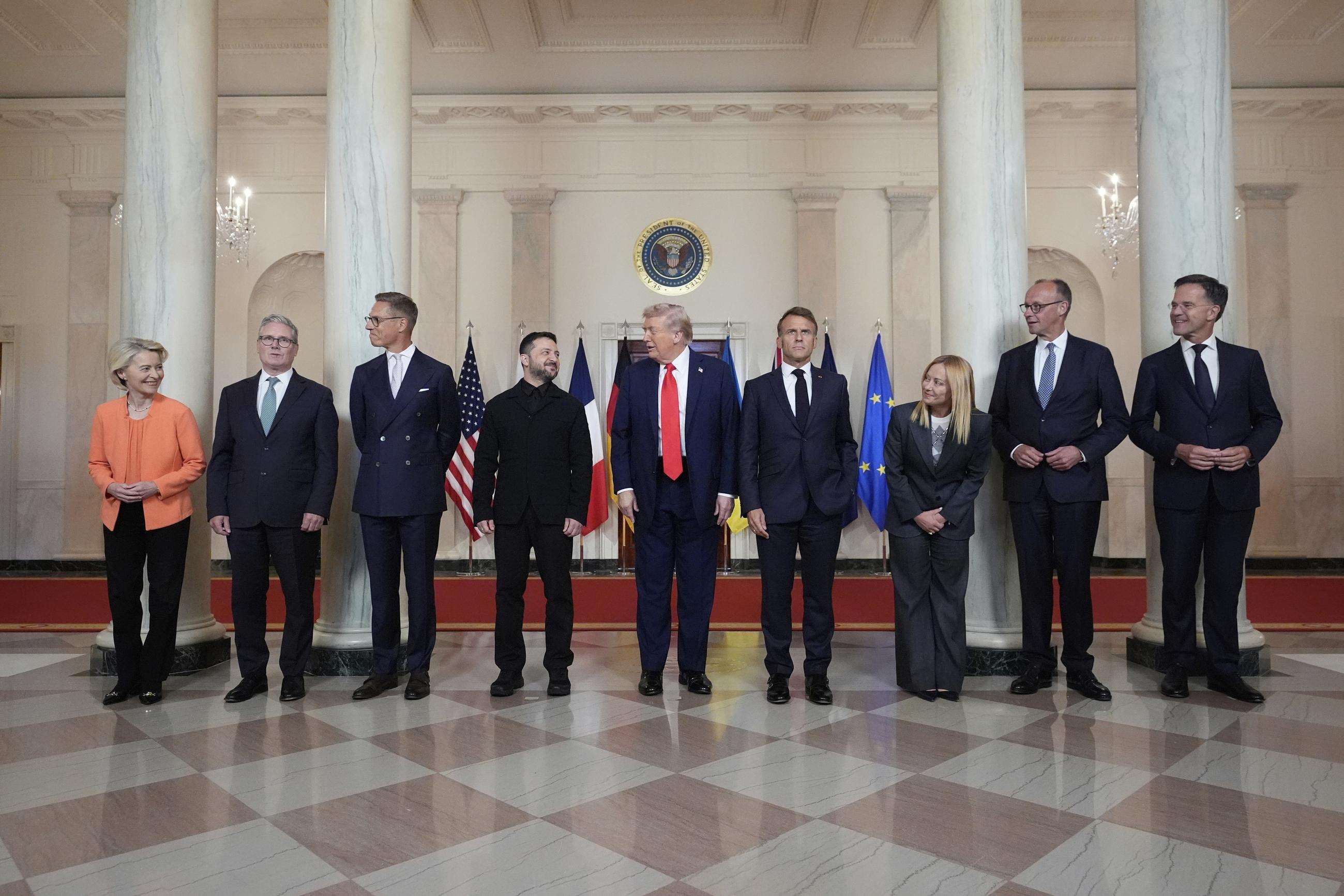 (From left) European Commission President Ursula von der Leyen, British Prime Minister Keir Starmer, Finland's President Alexander Stubb, Ukrainian President Volodymyr Zelensky, President Trump, France's President Emmanuel Macron, Italy's Prime Minister Giorgia Meloni, Germany's Chancellor Friedrich Merz, and NATO Secretary General Mark Rutte in the Grand Foyer of the White House on Monday (AP Photo/Alex Brandon)