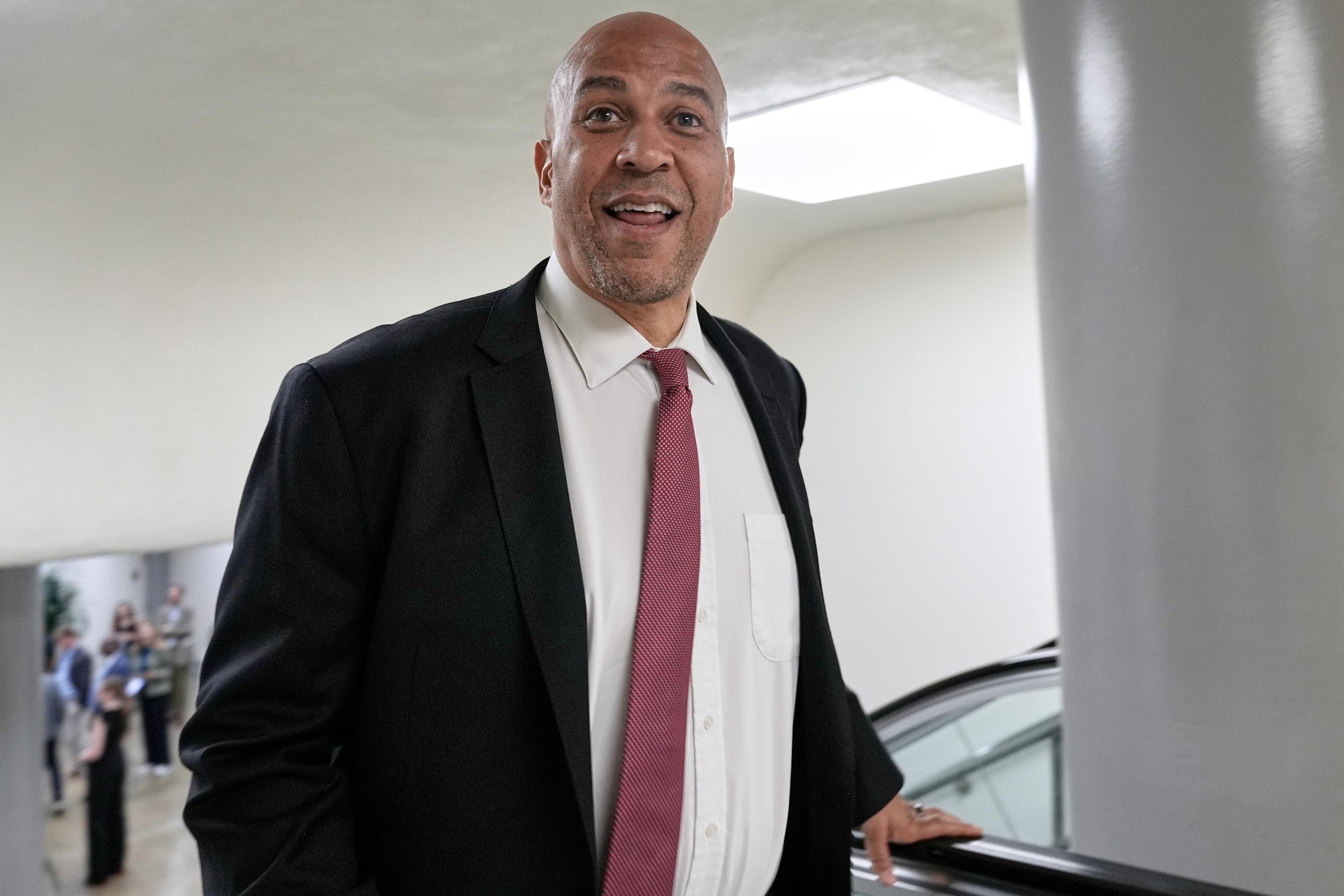 Sen. Cory Booker, D-N.J., speaks with reporters at the Capitol subway, Thursday, July 31, 2025, in Washington. (AP Photo/Mariam Zuhaib)