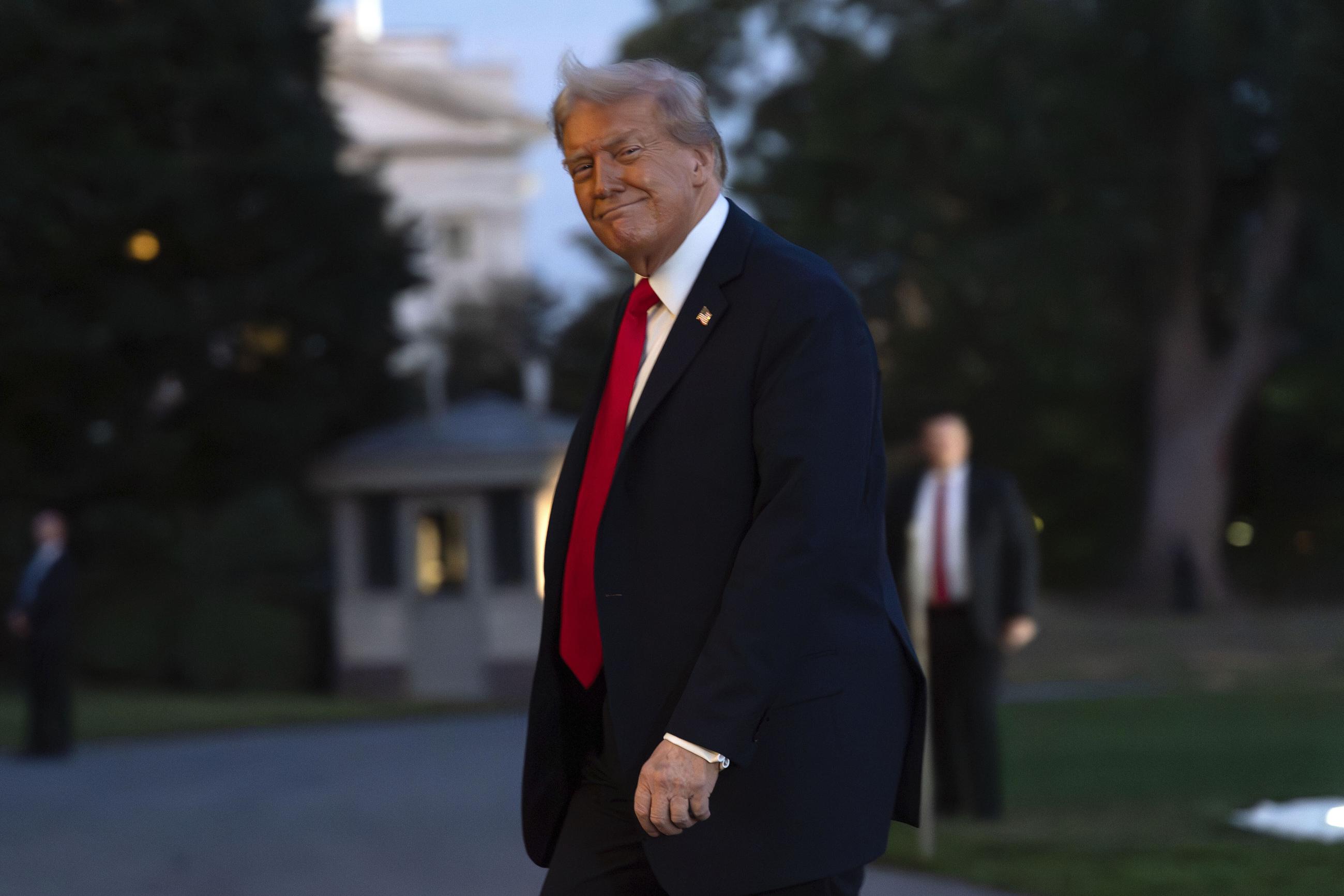 President Donald Trump walks on the South Lawn upon his arrival to the White House, in Washington, Sunday, Sept. 7, 2025. (AP Photo/Jose Luis Magana)