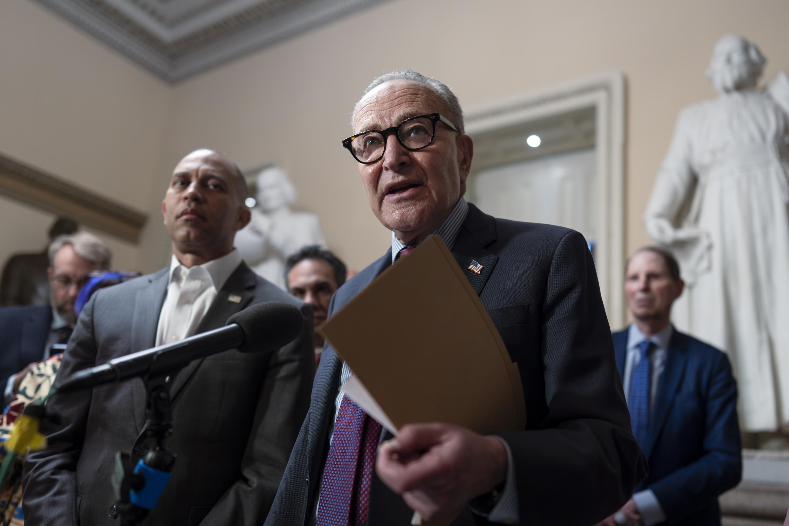 House Democratic Leader Hakeem Jeffries, left, and Senate Democratic Leader Chuck Schumer, both of New York, tell reporters that they are united as the Sept. 30 funding deadline approaches, at the Capitol in Washington, Thursday, Sept. 11, 2025. (AP Photo/J. Scott Applewhite)