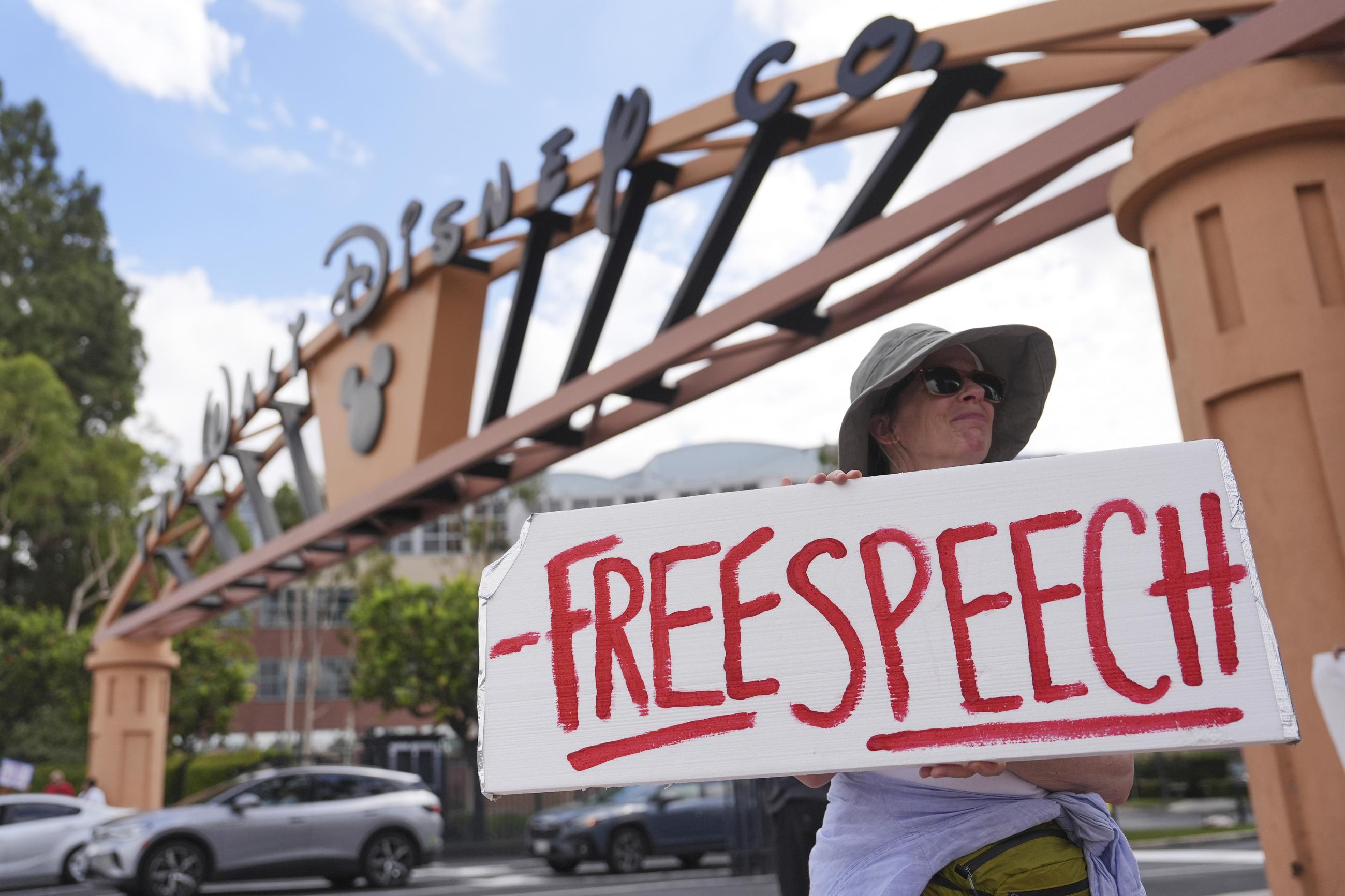A demonstrator holds a sign in response to the suspension of Jimmy Kimmel's late-night show outside of Walt Disney Studios in Burbank, Calif., on Sept. 18. (AP Photo/Jae C. Hong)
