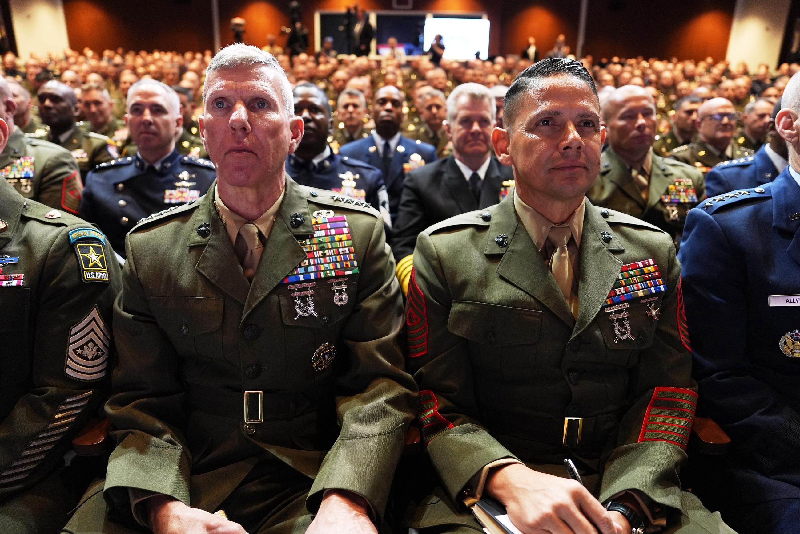U.S. military senior leadership listen as President Trump speaks at Marine Corps Base Quantico on Tuesday. (AP Photo/Evan Vucci)