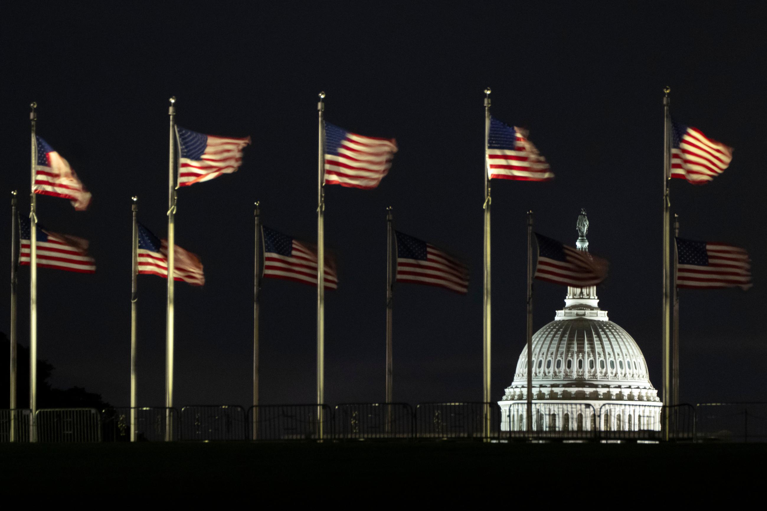 The dome of the U.S. Capitol is seen before dawn on Wednesday, Oct. 1, 2025, in Washington. (AP Photo/Mark Schiefelbein)