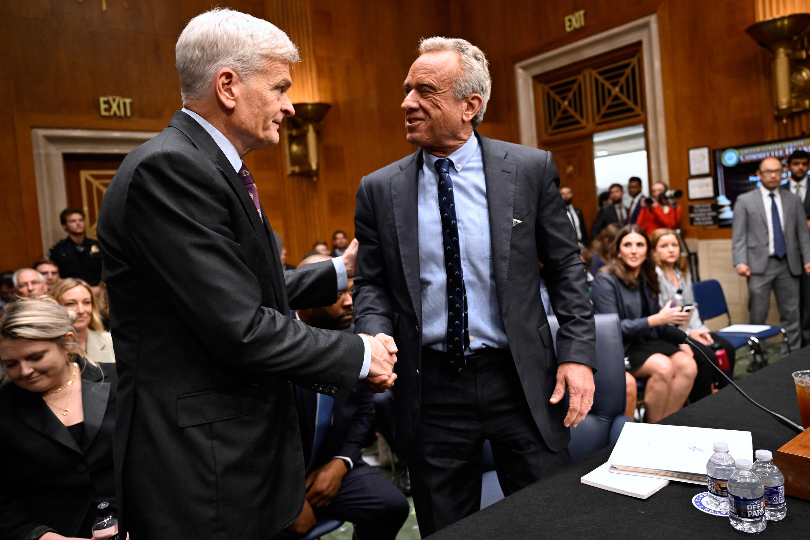 Sen. Bill Cassidy (left) greets Health and Human Services Secretary Robert F. Kennedy Jr., before he testifies at a Health, Education, Labor and Pensions committee hearing, May 14. (AP Photo/John McDonnell)