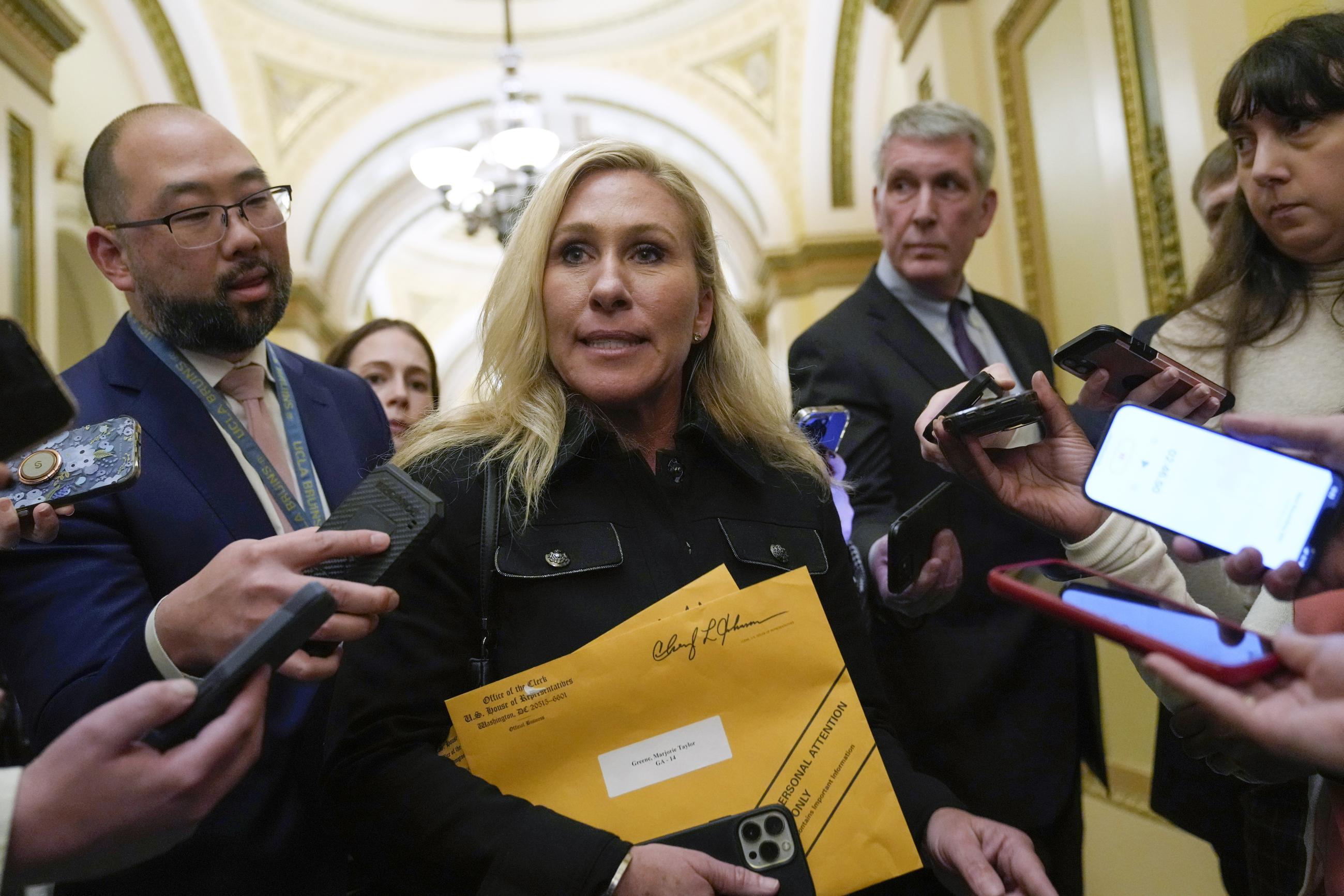 Rep. Marjorie Taylor Greene, R-Ga., talks with reporters on Capitol Hill in Washington, Tuesday, Jan. 3, 2023, after the House adjourned following the third failed attempt to elect a Speaker of the House for the 118th Congress. (AP Photo/Susan Walsh)