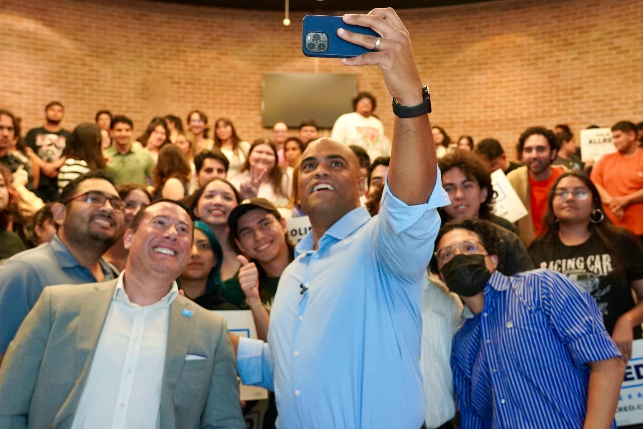 Former Rep. Colin Allred takes a photo with members of the University of Texas Rio Grande Valley College Democrats after a meeting on campus in Edinburg, Texas, on Oct. 2.