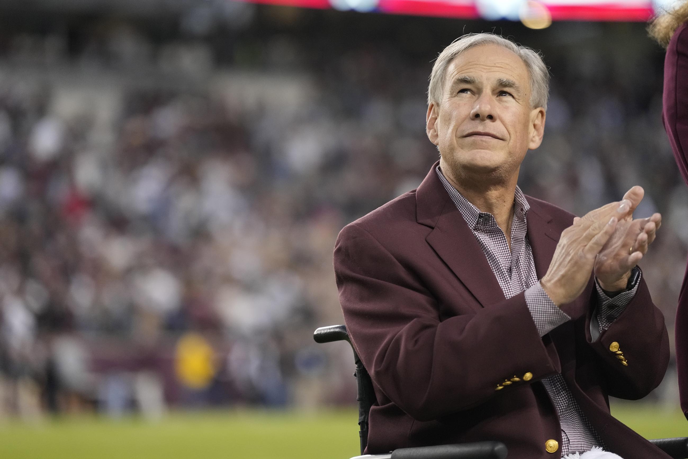 Texas Gov. Greg Abbott before the start of an NCAA college football game in College Station, Texas, in 2022 (AP Photo/Sam Craft)