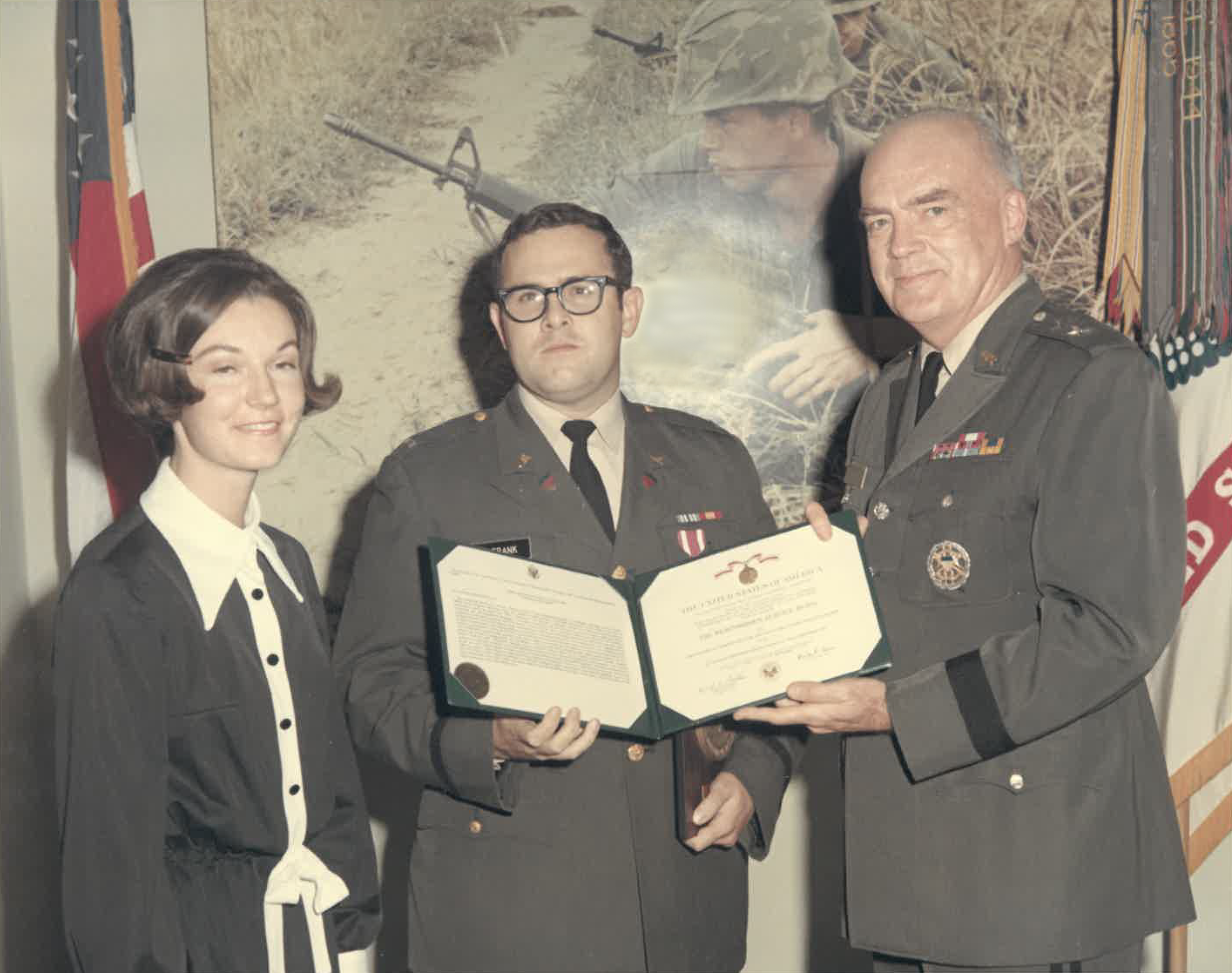 Lt. Thomas DeFrank, with his wife and Maj. Gen. Winant Sidle, after receiving the Meritorious Service Medal award. (National Journal/Tom DeFrank)
