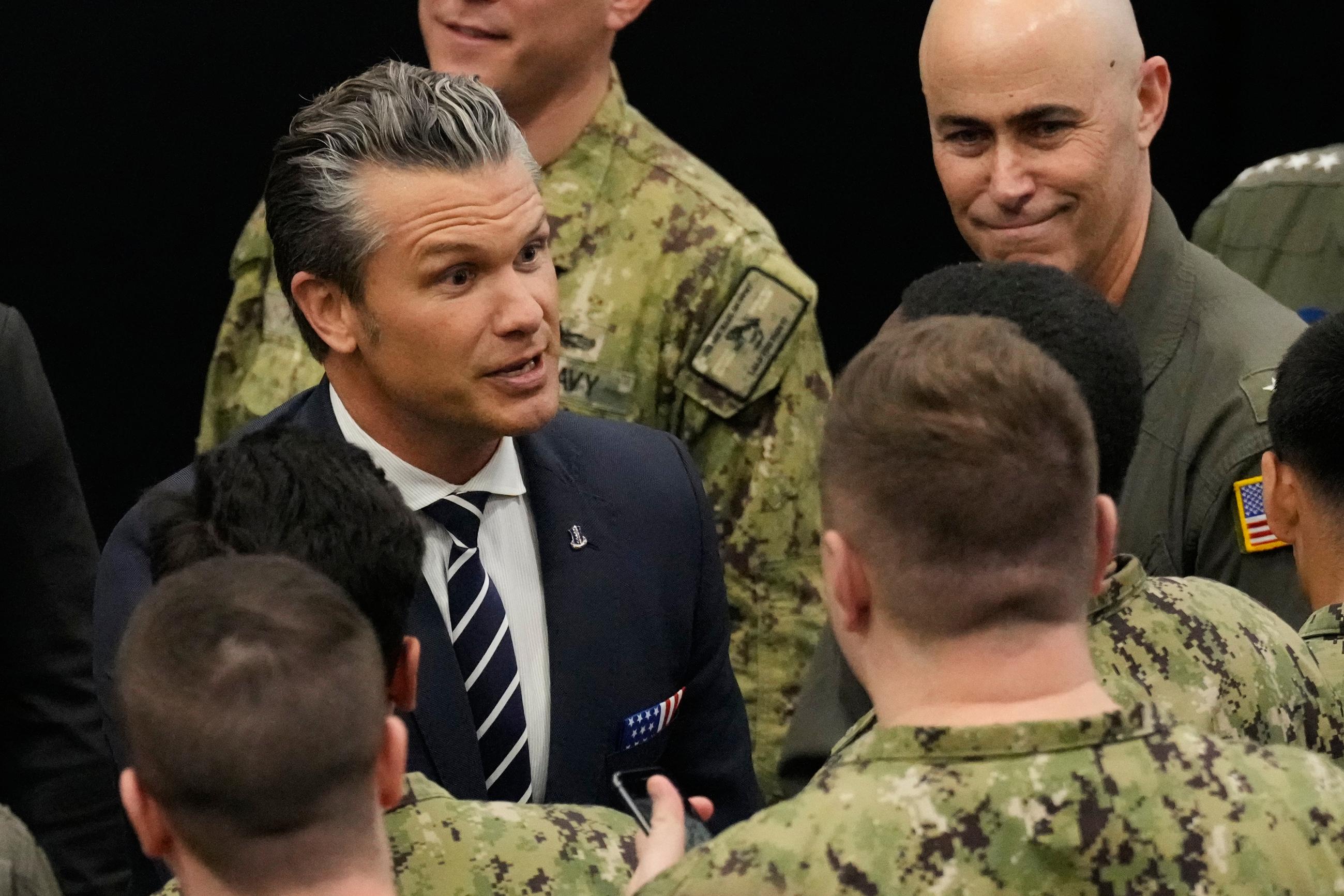 U.S. Defense Secretary Pete Hegseth talks to soldiers and servicemen ahead of the arrival of U.S. President Donald Trump to the USS George Washington at the U.S. Navy's Yokosuka base in Yokosuka, south of Tokyo, Tuesday, Oct. 28, 2025. (AP Photo/Eugene Hoshiko)