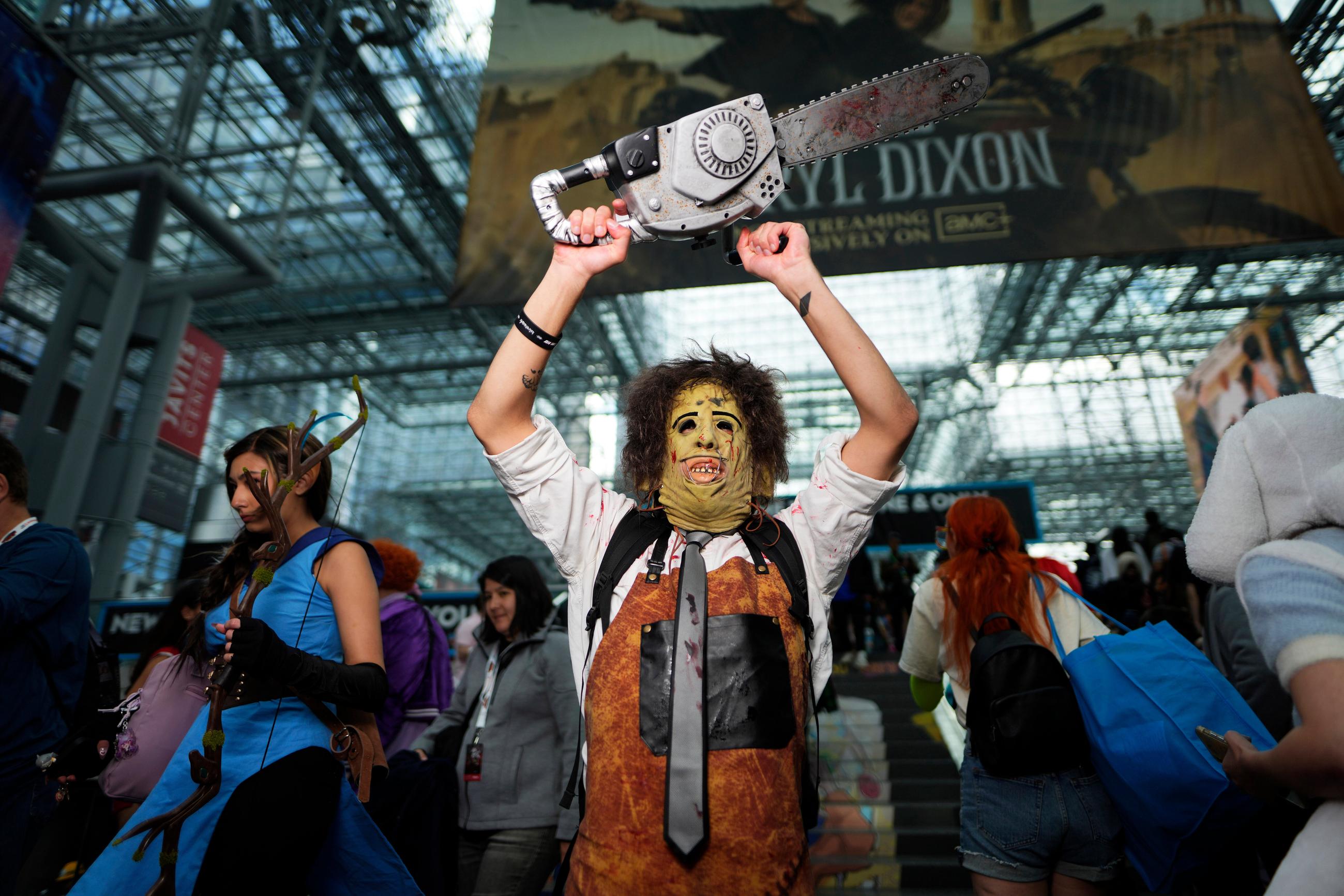 An attendee dressed as Leatherface from The Texas Chainsaw Massacre poses during New York Comic Con at the Jacob K. Javits Convention Center on Friday, Oct. 10, 2025, in New York. (Photo by Charles Sykes/Invision/AP)