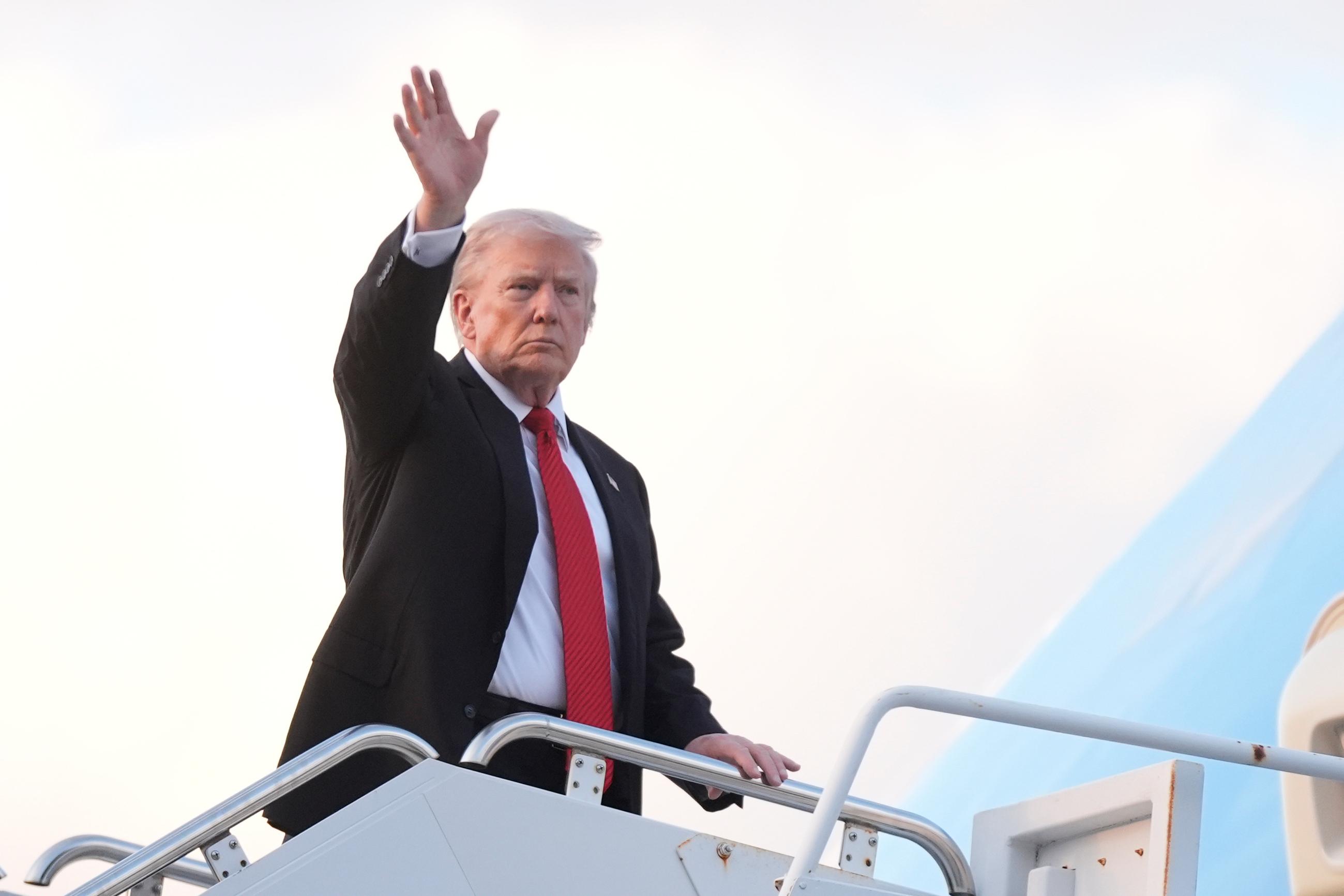 President Donald Trump waves as he boards Air Force One at Palm Beach International Airport in West Palm Beach Fla., on his way back to the White House following a weekend at his Mar-a-Lago estate, Sunday, Nov. 2, 2025. (AP Photo/Manuel Balce Ceneta)
