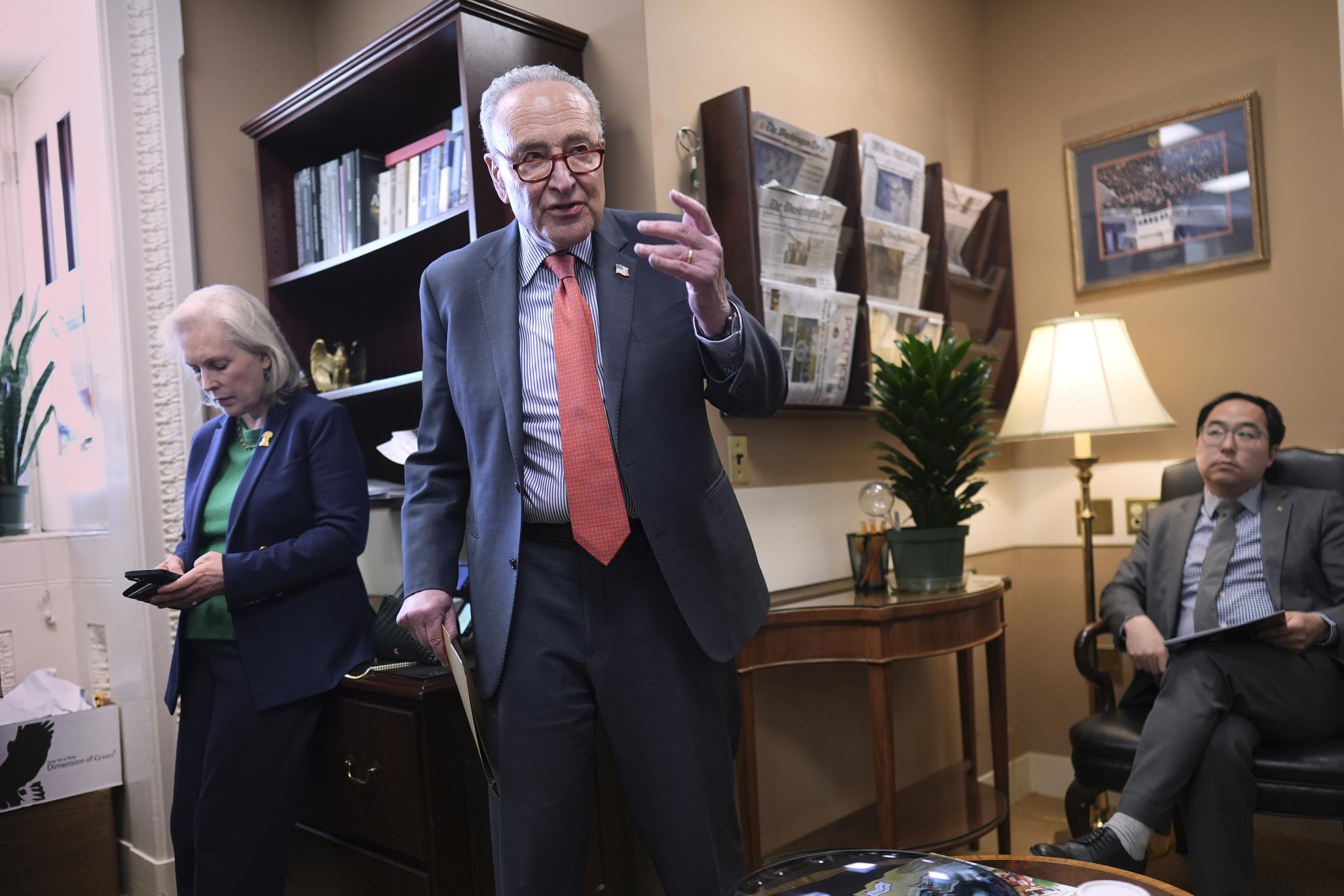 Senate Minority Leader Chuck Schumer, with Democratic Senatorial Campaign Committee Chair Kirsten Gillibrand and Sen. Andy Kim. (AP Photo/J. Scott Applewhite)