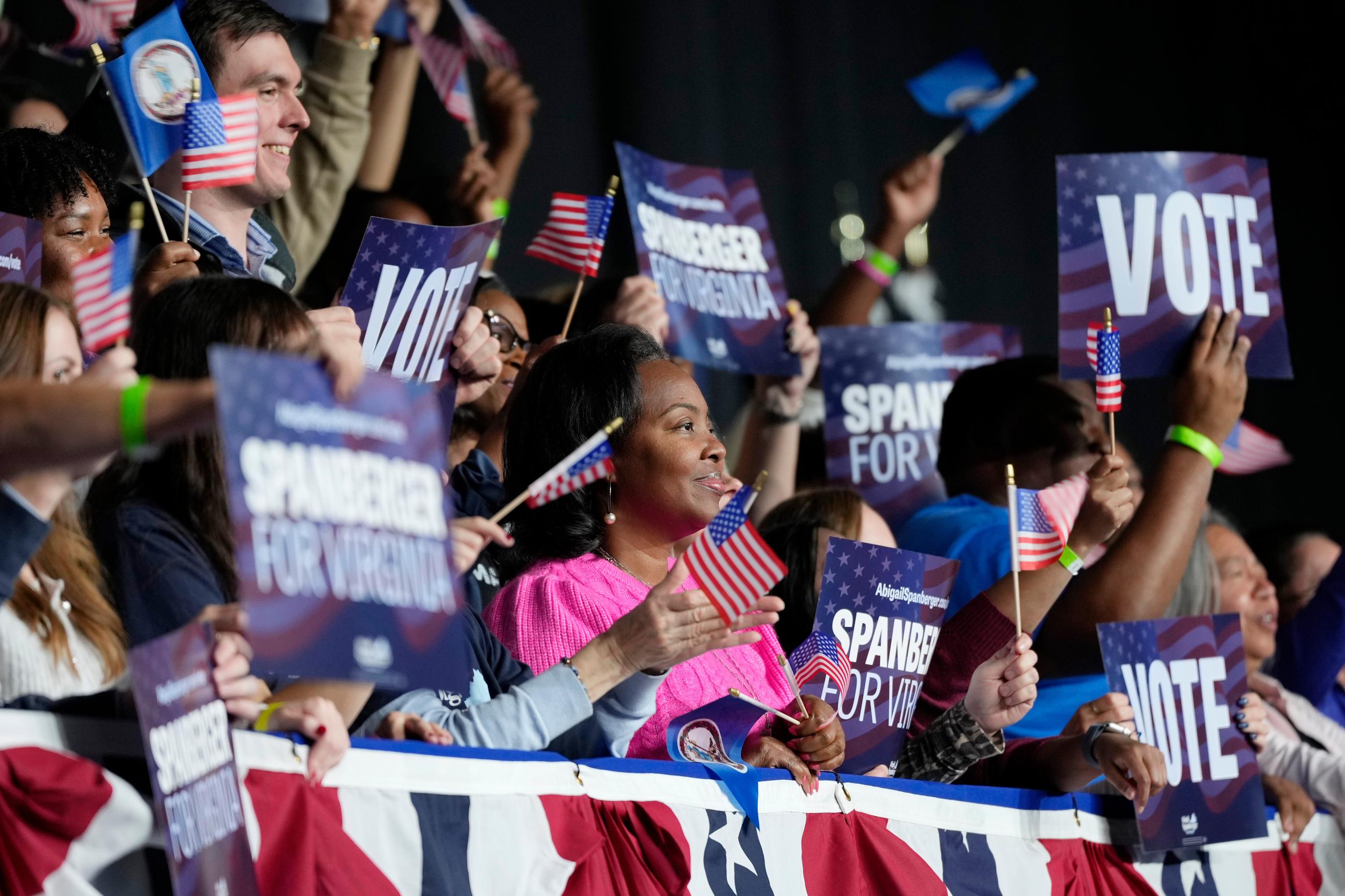 Supporters of Virginia Democratic gubernatorial candidate Abigail Spanberger cheer during a campaign event with former President Barack Obama, Saturday, Nov. 1, 2025, in Norfolk, Va. (AP Photo/Steve Helber)