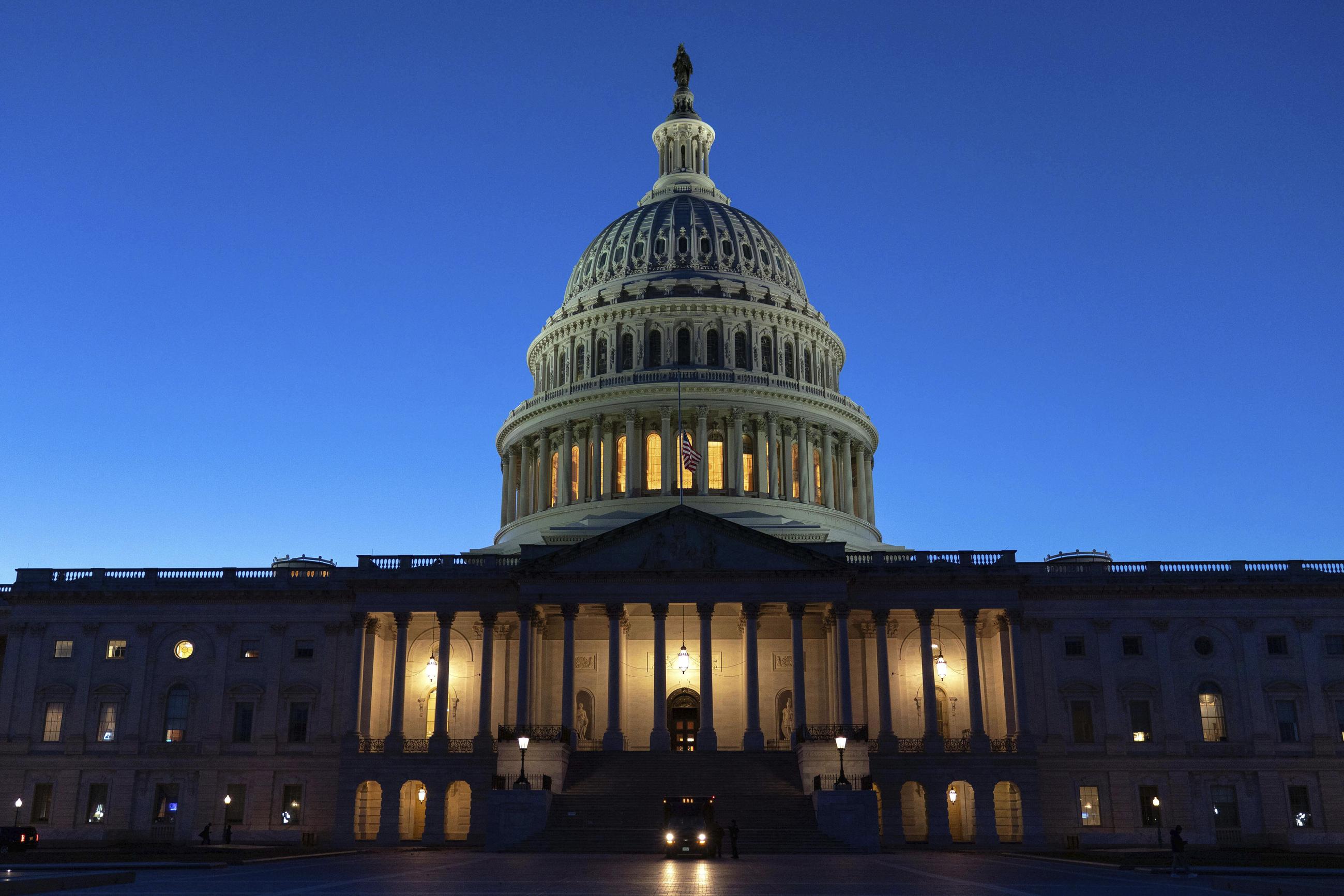 The U.S. Capitol is seen on a sunset a day before the House prepares to vote on a bill to reopen the government at the Capitol in Washington, Tuesday, Nov. 11, 2025. (AP Photo/Jose Luis Magana)