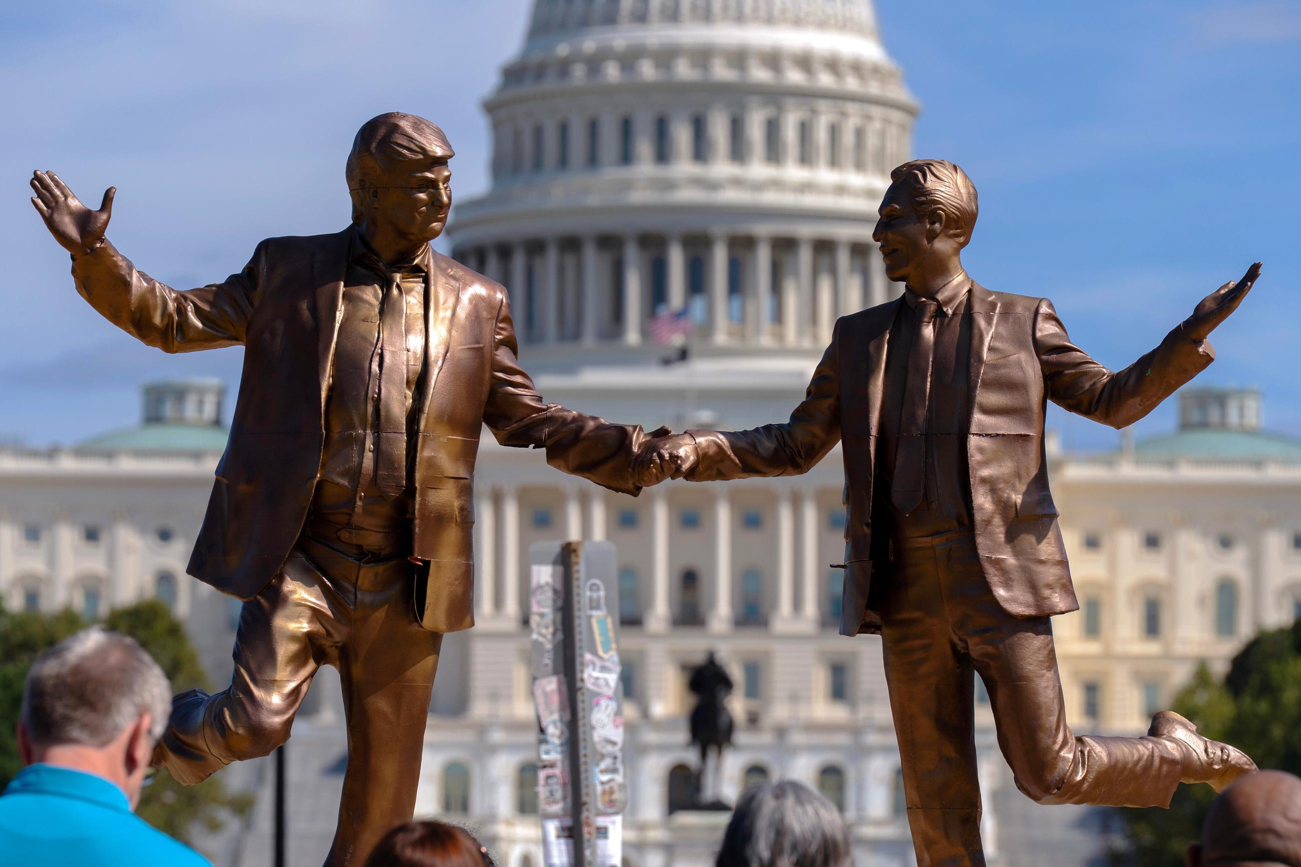 An art installation representing President Trump and Jeffrey Epstein holding hands stands on the National Mall near the Capitol on Oct. 3. (AP Photo/Jose Luis Magana, File)
