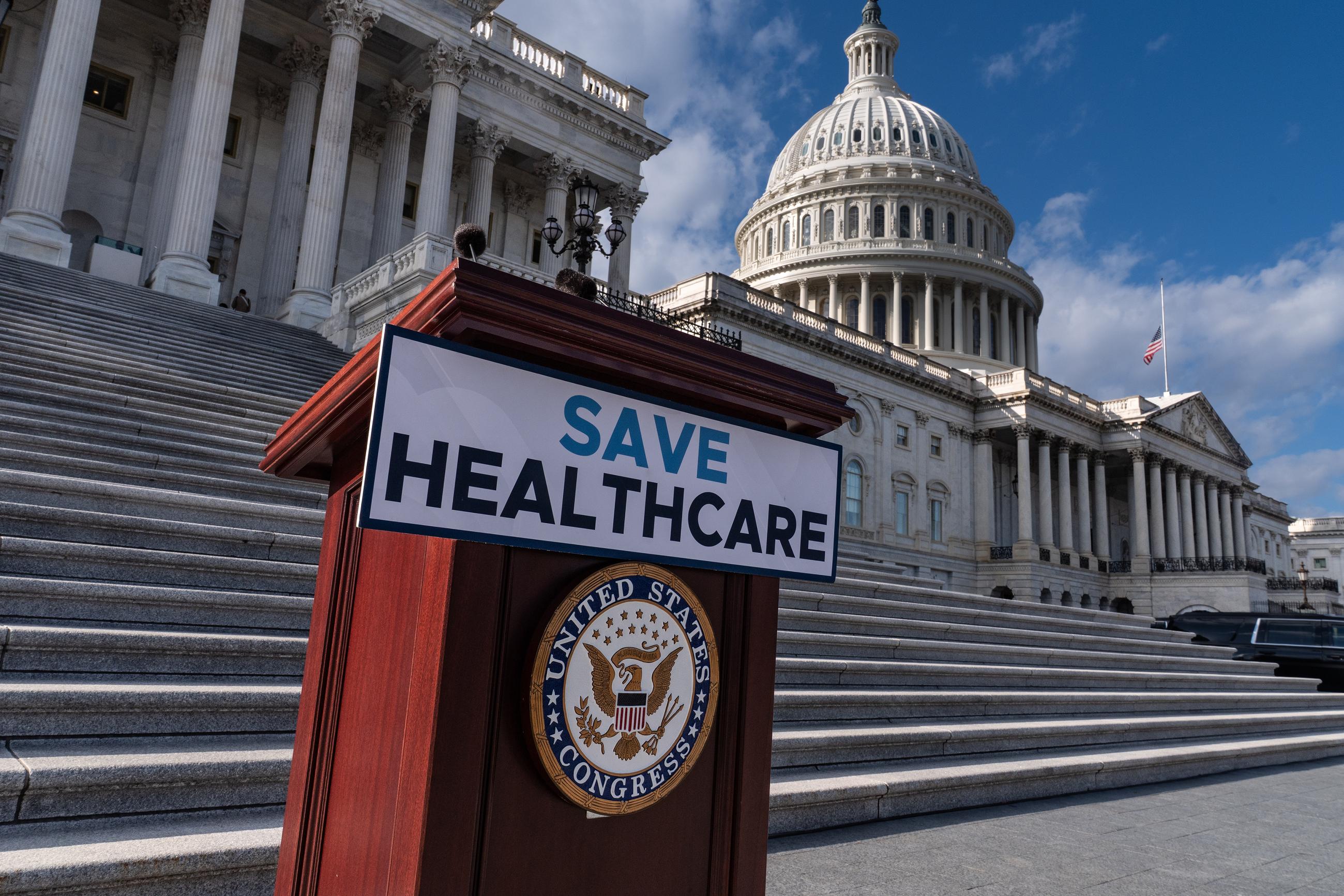 A lectern awaits the arrival of House Democrats to speak on the health care funding fight on the steps of the House before votes took place to end the government shutdown on Wednesday. (AP Photo/J. Scott Applewhite)