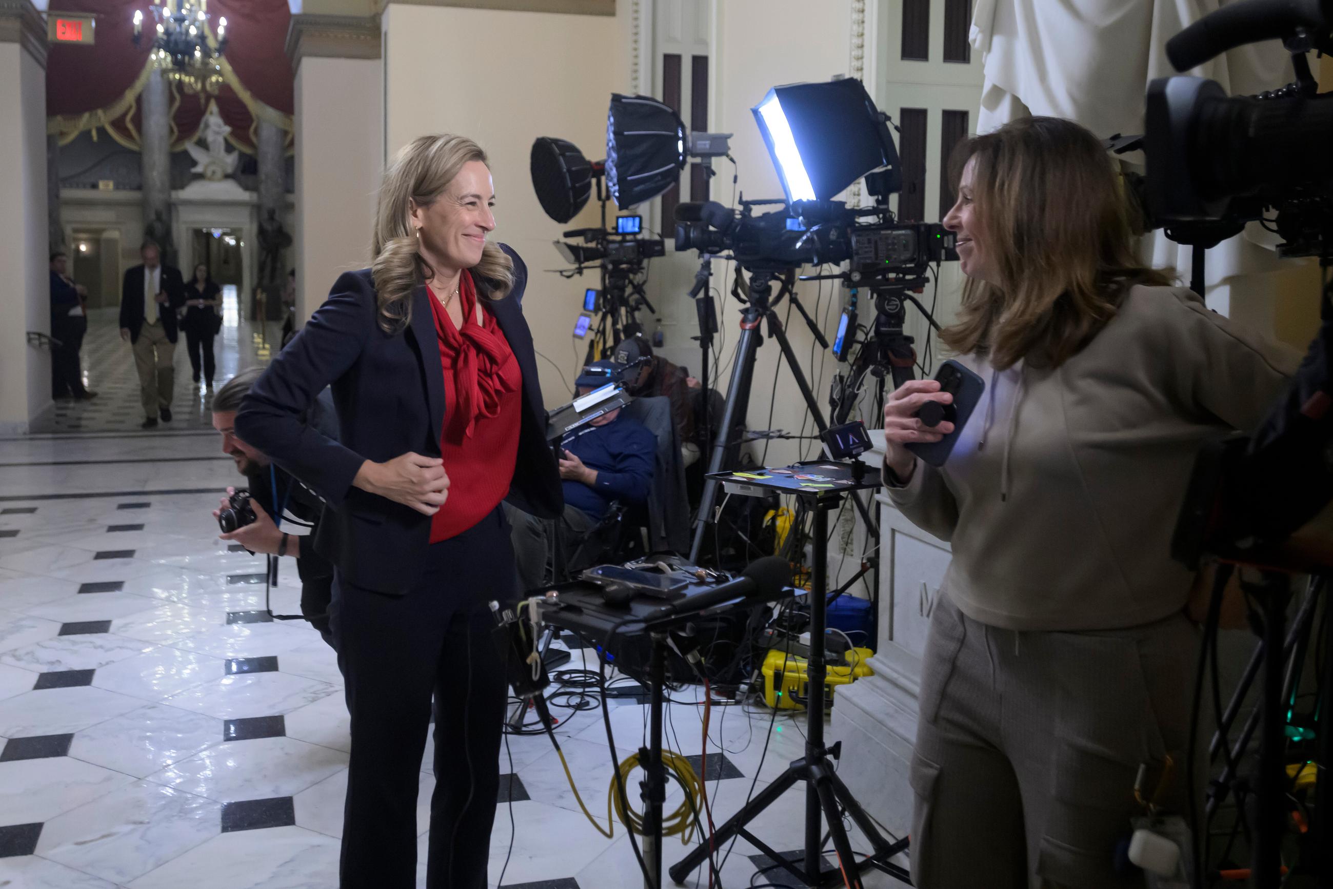 New Jersey Gov.-elect Rep. Mikie Sherrill, D-N.J., left, prepares for a television interview at the U.S. Capitol, Wednesday, Nov. 12, 2025, in Washington. (AP Photo/Rod Lamkey, Jr.)