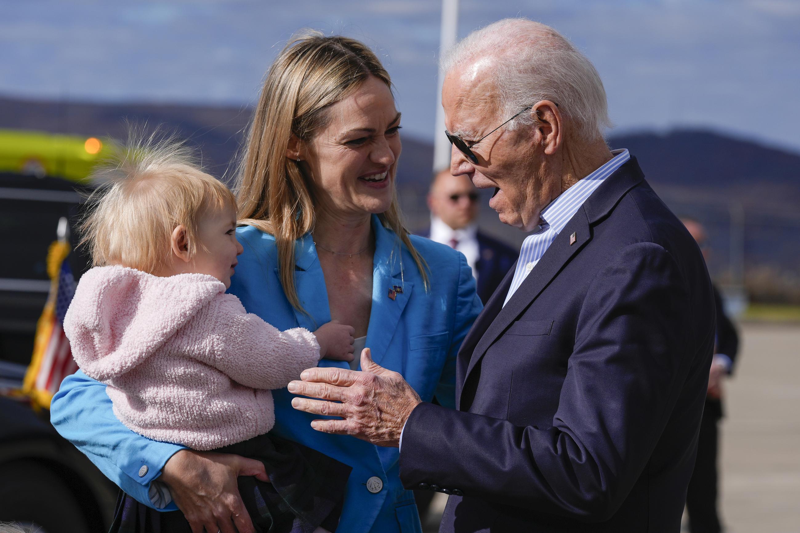 President Joe Biden, right, is greeted on the tarmac by Scanton Mayor Paige Cognetti, center and her daughter Brooke Anne, at Wilkes-Barre Scranton International Airport in Scranton, Pa., Saturday, Nov. 2, 2024. (AP Photo/Manuel Balce Ceneta)