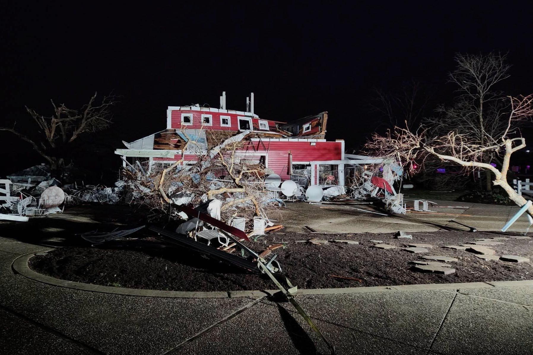 In this photo provided by Missouri State Highway Patrol, a home is damaged after a severe storm passed the area near Ozark County, Mo., on March 14. (Missouri State Highway Patrol via AP)
