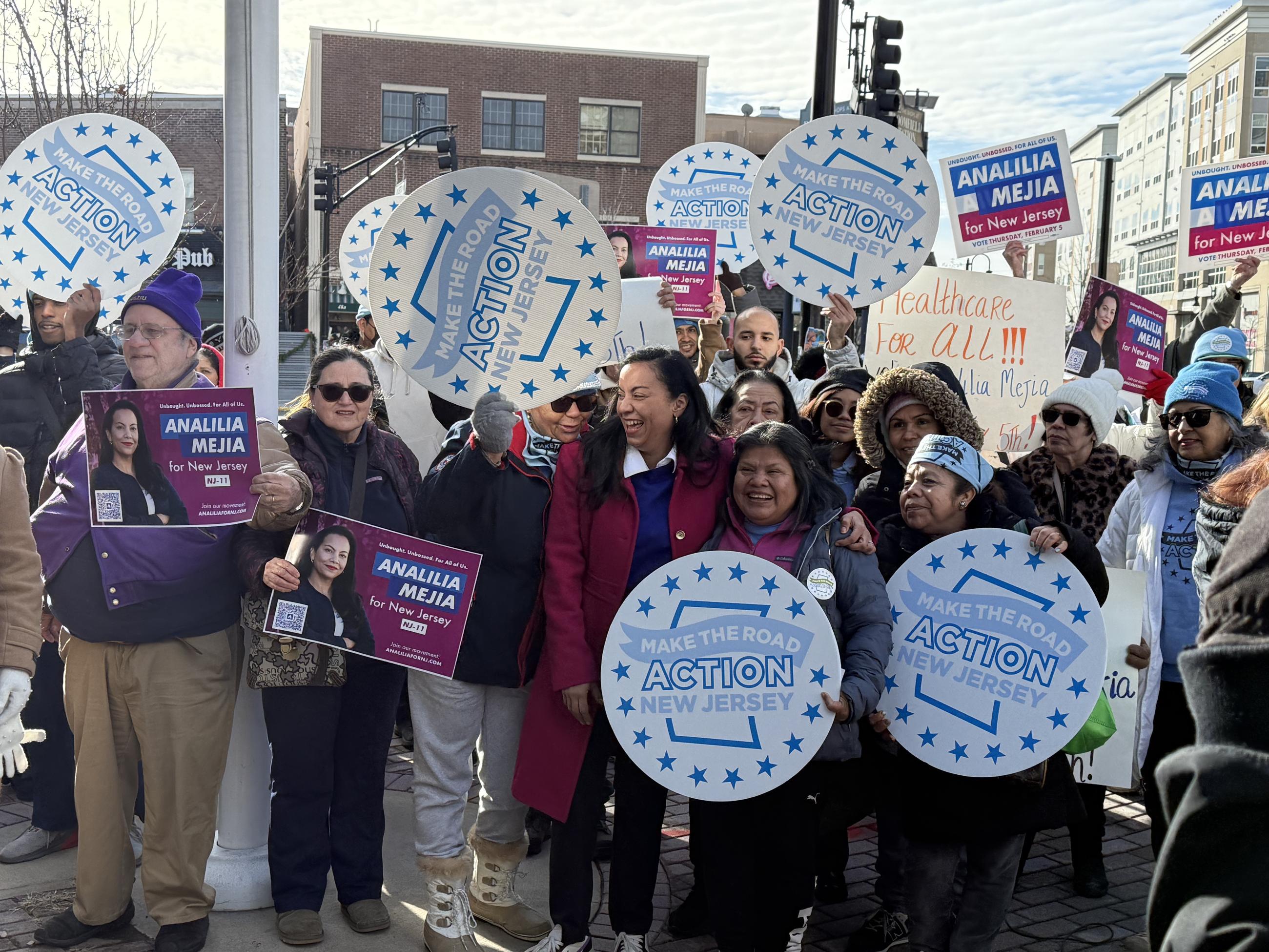 Analilia Mejía, a Democratic congressional candidate in New Jersey's 11th Congressional District, takes photos with supporters at a campaign event with Make the Road Action New Jersey on Dec. 20 in Bloomfield, N.J. (National Journal/Nicholas Anastácio)